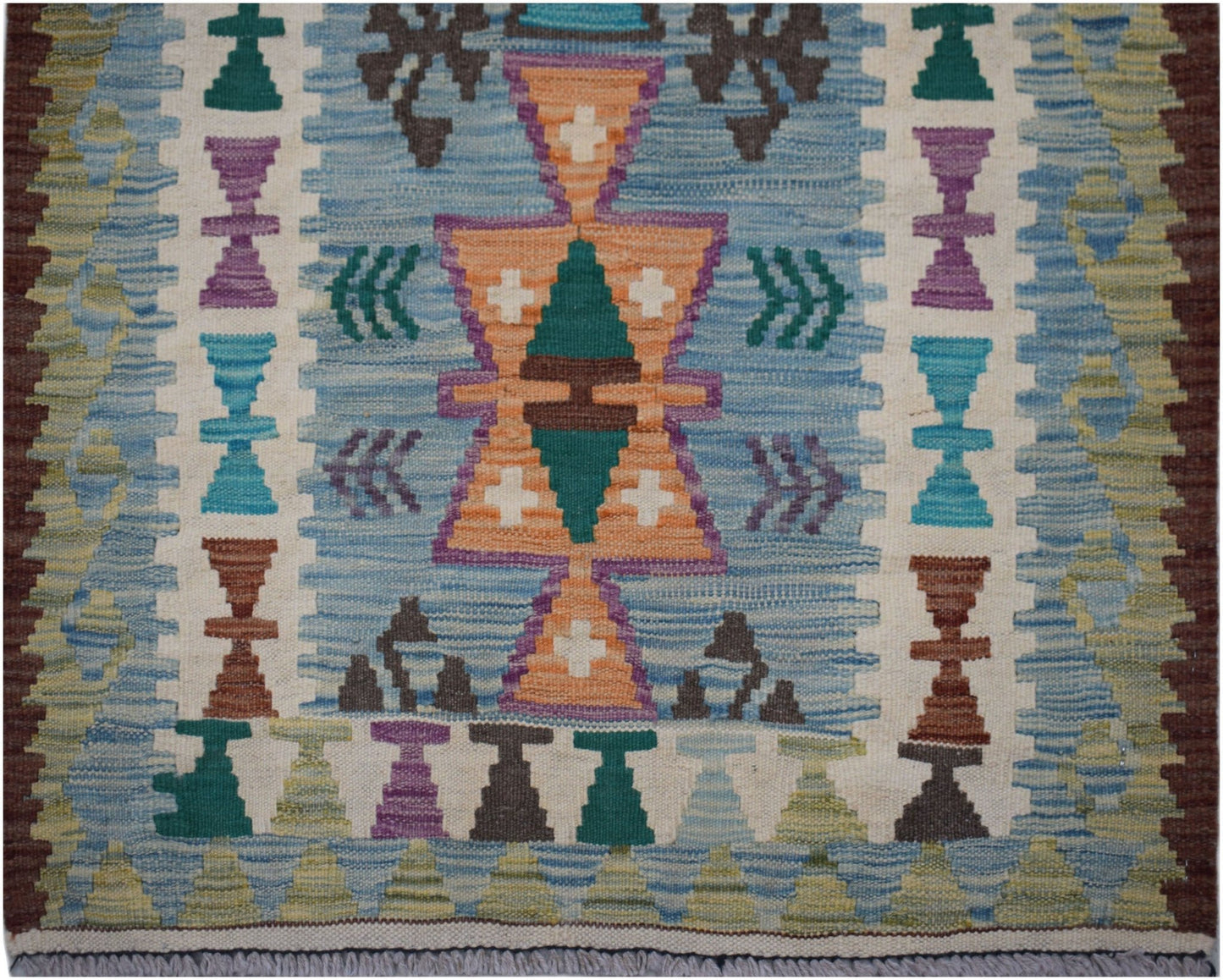 Handwoven Afghan Maimana wool runner featuring a geometric pattern in blue, orange, and purple.