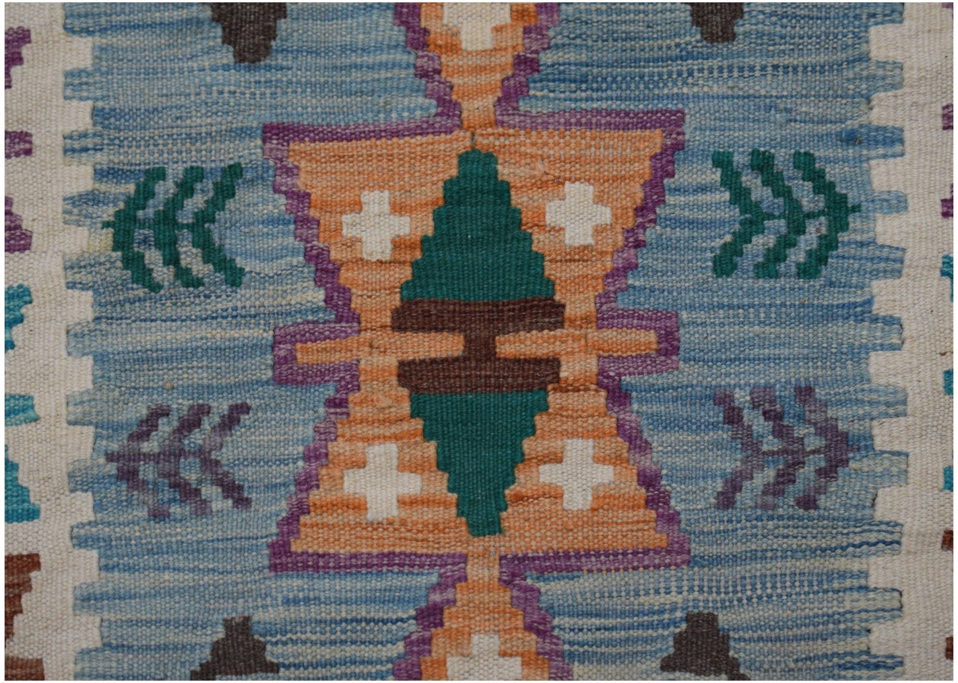 Handwoven Afghan Maimana kilim runner featuring a geometric pattern in blue, orange, and green.