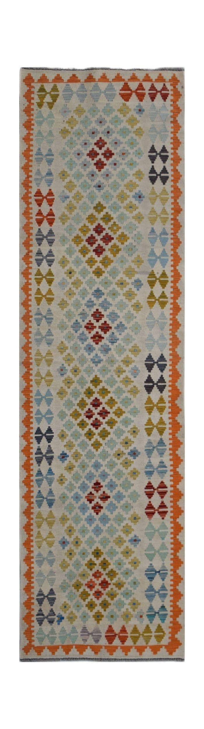 Handwoven Afghan Maimana wool runner featuring a colorful geometric diamond pattern.