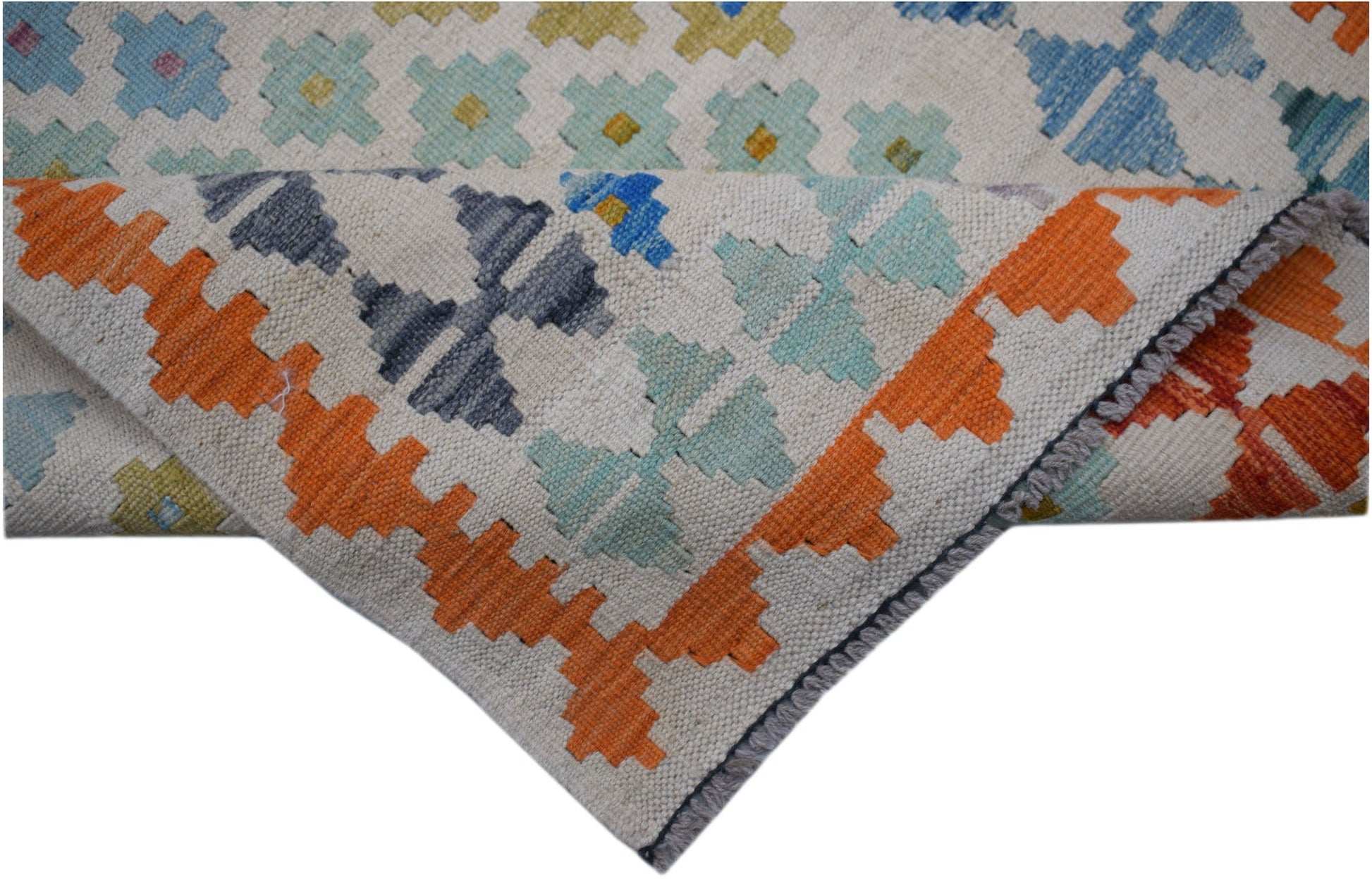 A handmade Afghan Maimana kilim runner featuring a geometric pattern in vibrant wool colors.