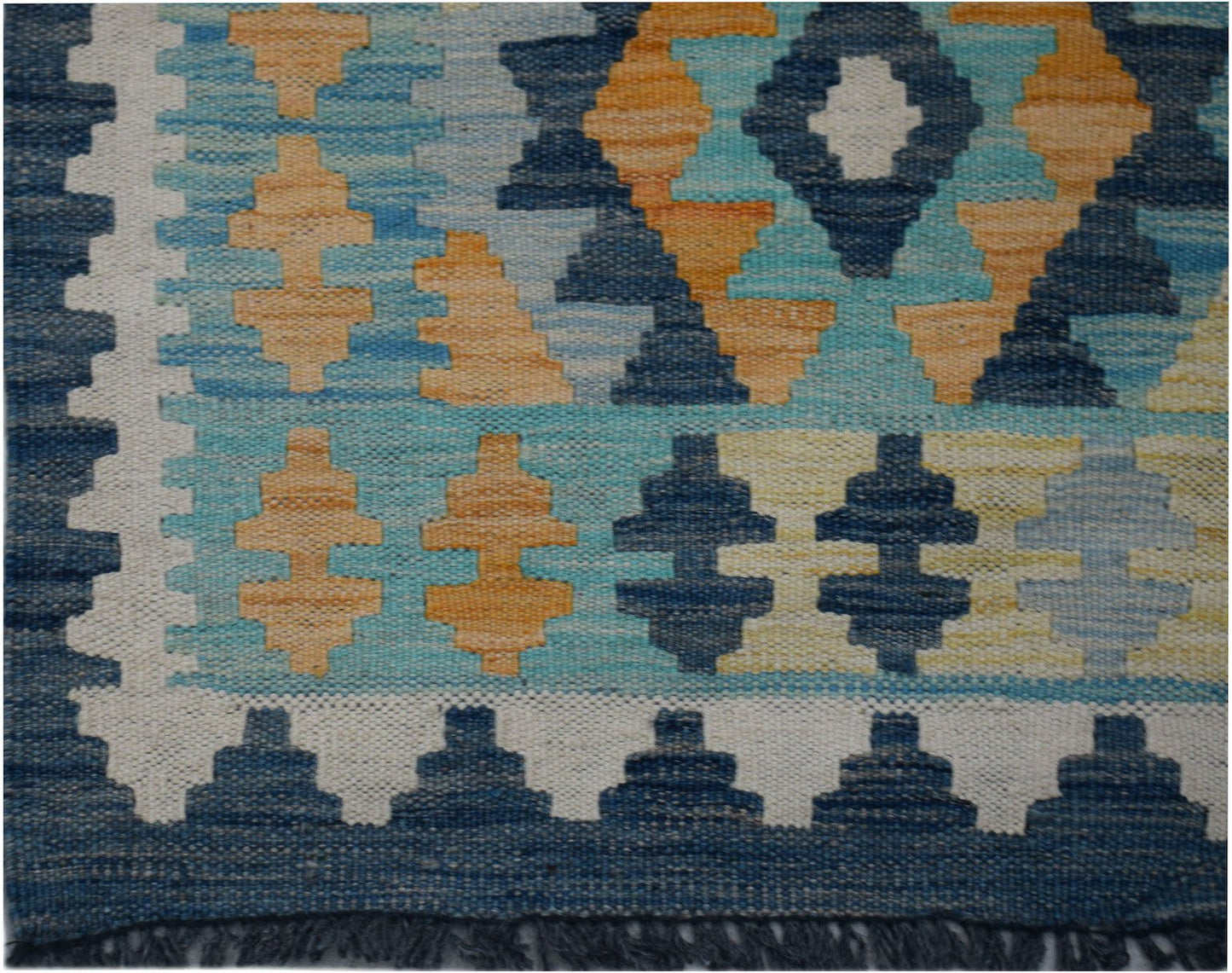 Handwoven Afghan Maimana kilim runner featuring a geometric pattern in blue, orange, and cream.