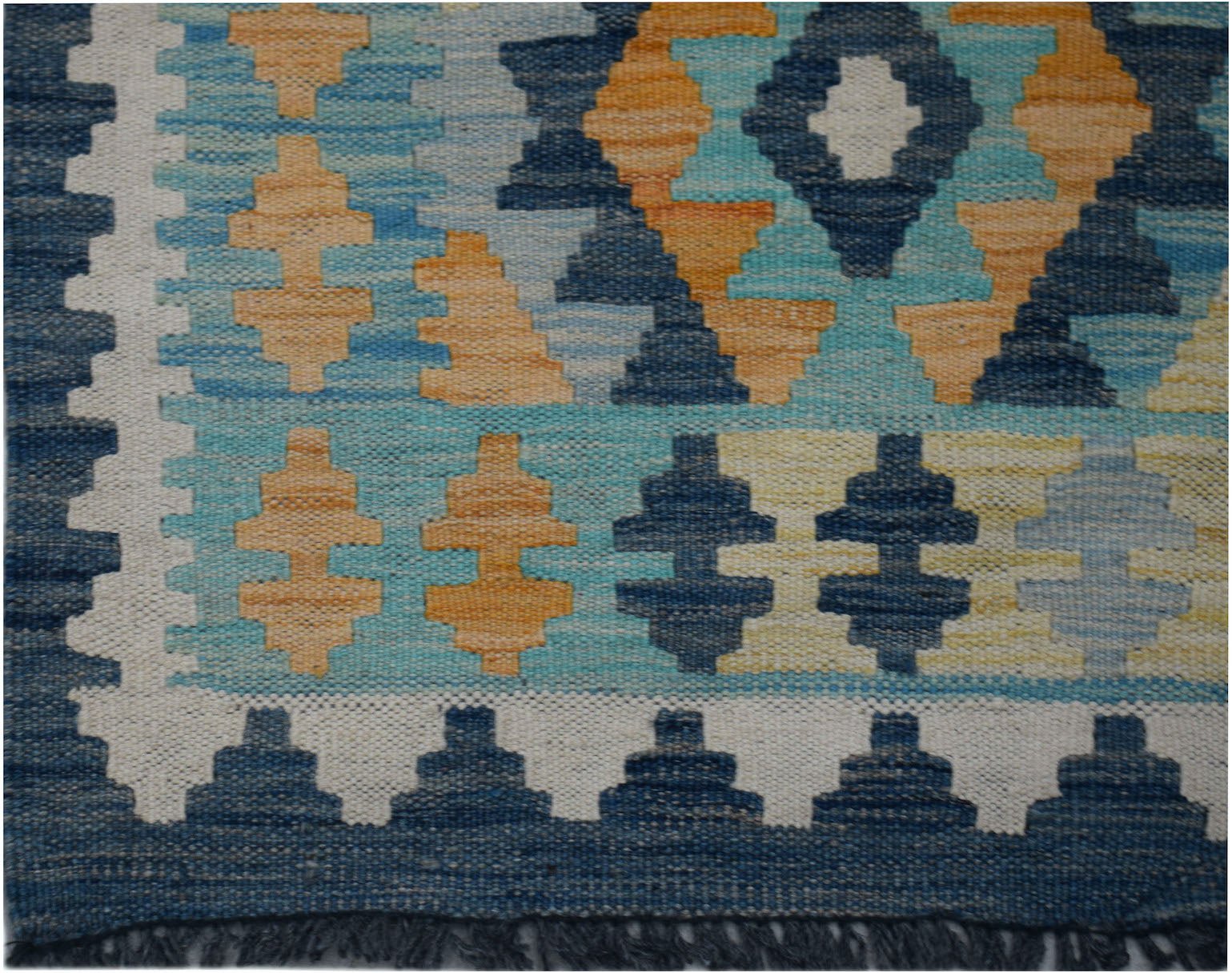 Handwoven Afghan Maimana kilim runner featuring a geometric pattern in blue, orange, and cream.