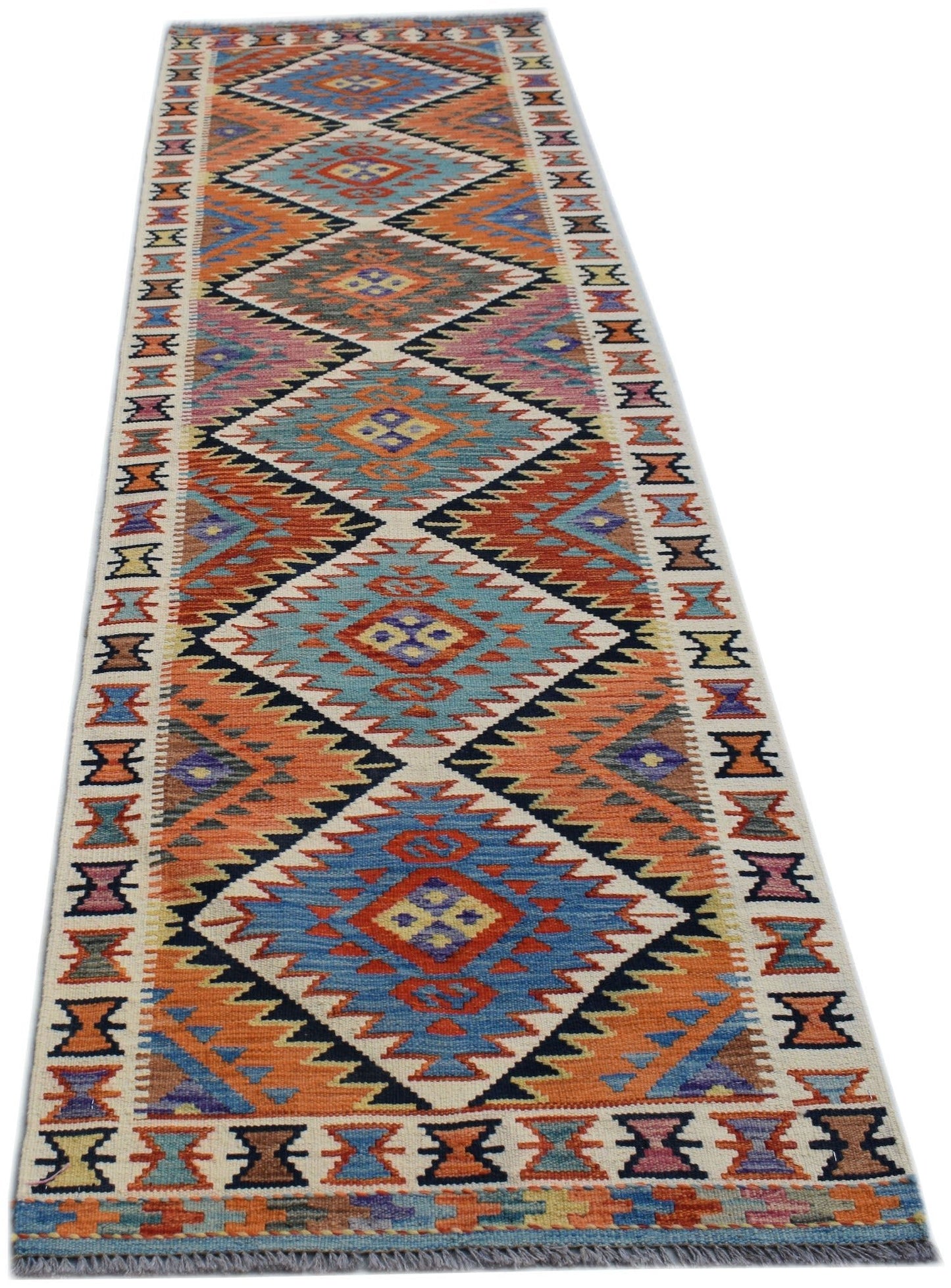 Handwoven Afghan Maimana wool runner rug featuring a colorful geometric diamond pattern.