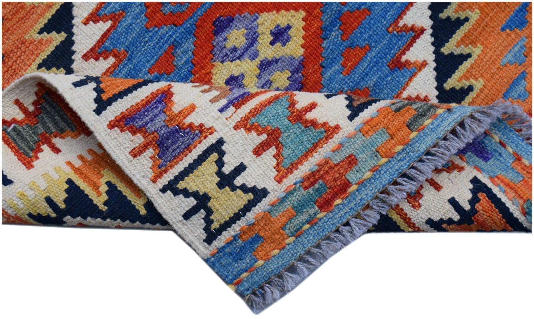 A handwoven Afghan Maimana wool kilim runner featuring vibrant geometric patterns and fringe.