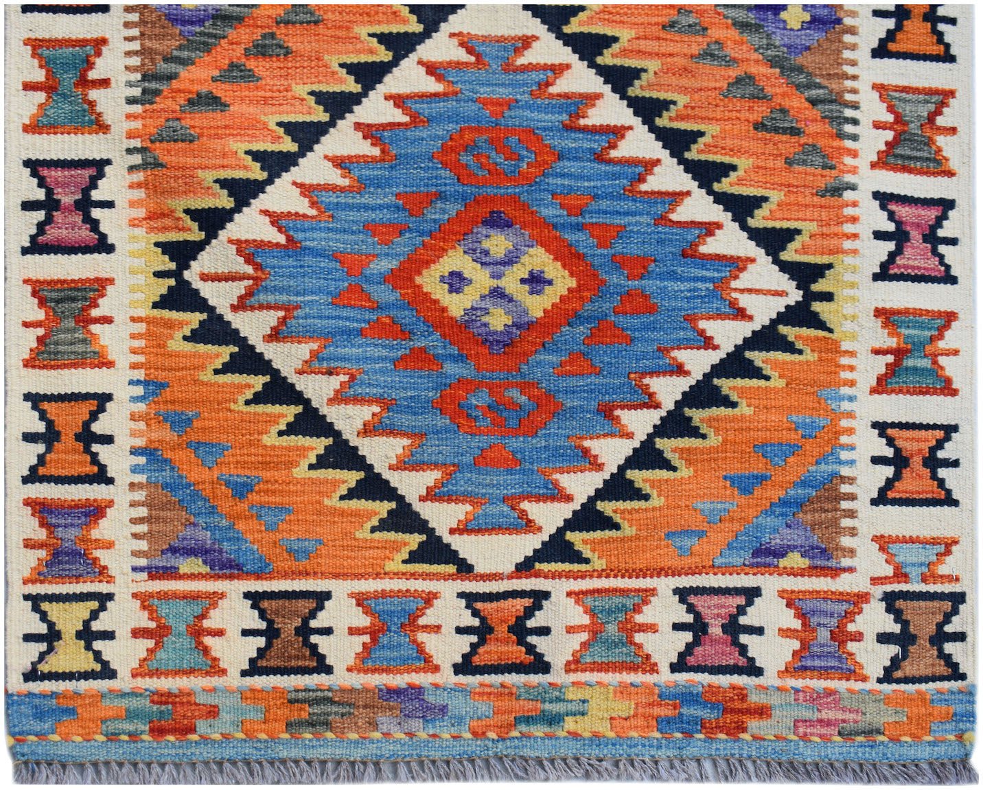 Handwoven Afghan Maimana wool runner featuring a vibrant geometric diamond pattern.