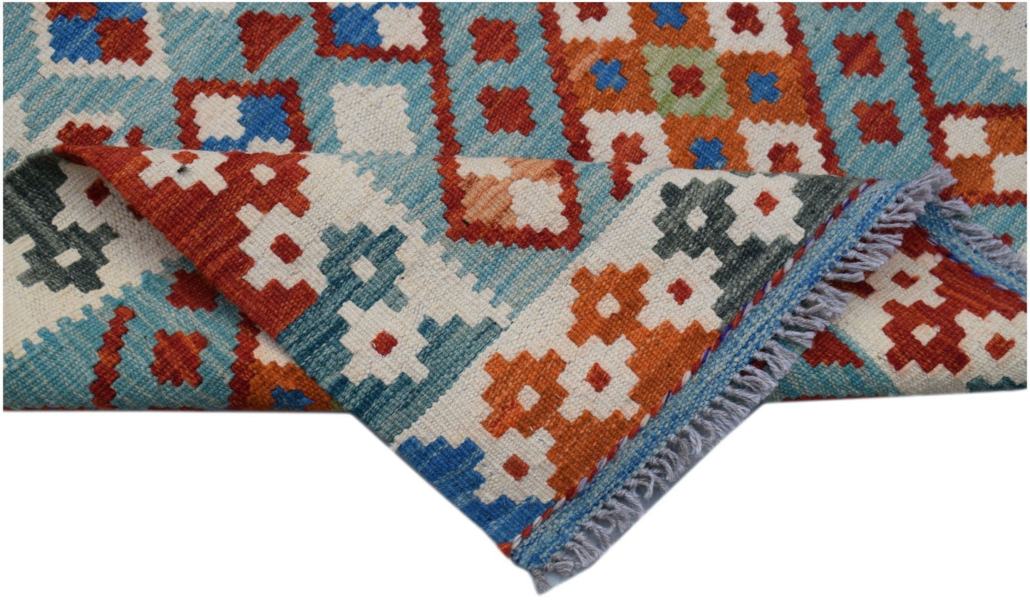 Handwoven Afghan Maimana wool kilim runner featuring a colorful geometric pattern.