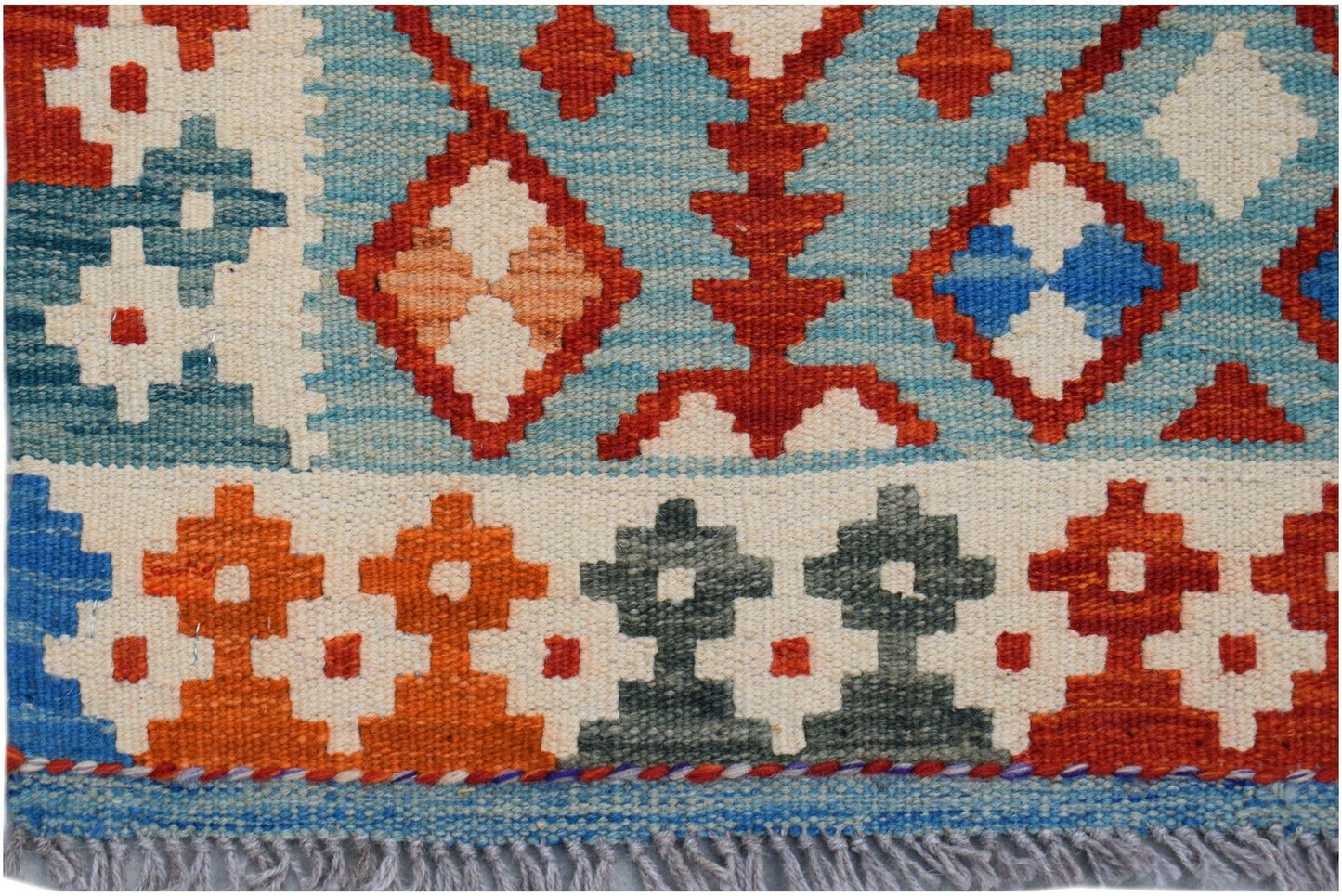 Handwoven Afghan Maimana wool kilim runner featuring geometric patterns in blue, orange, and red.