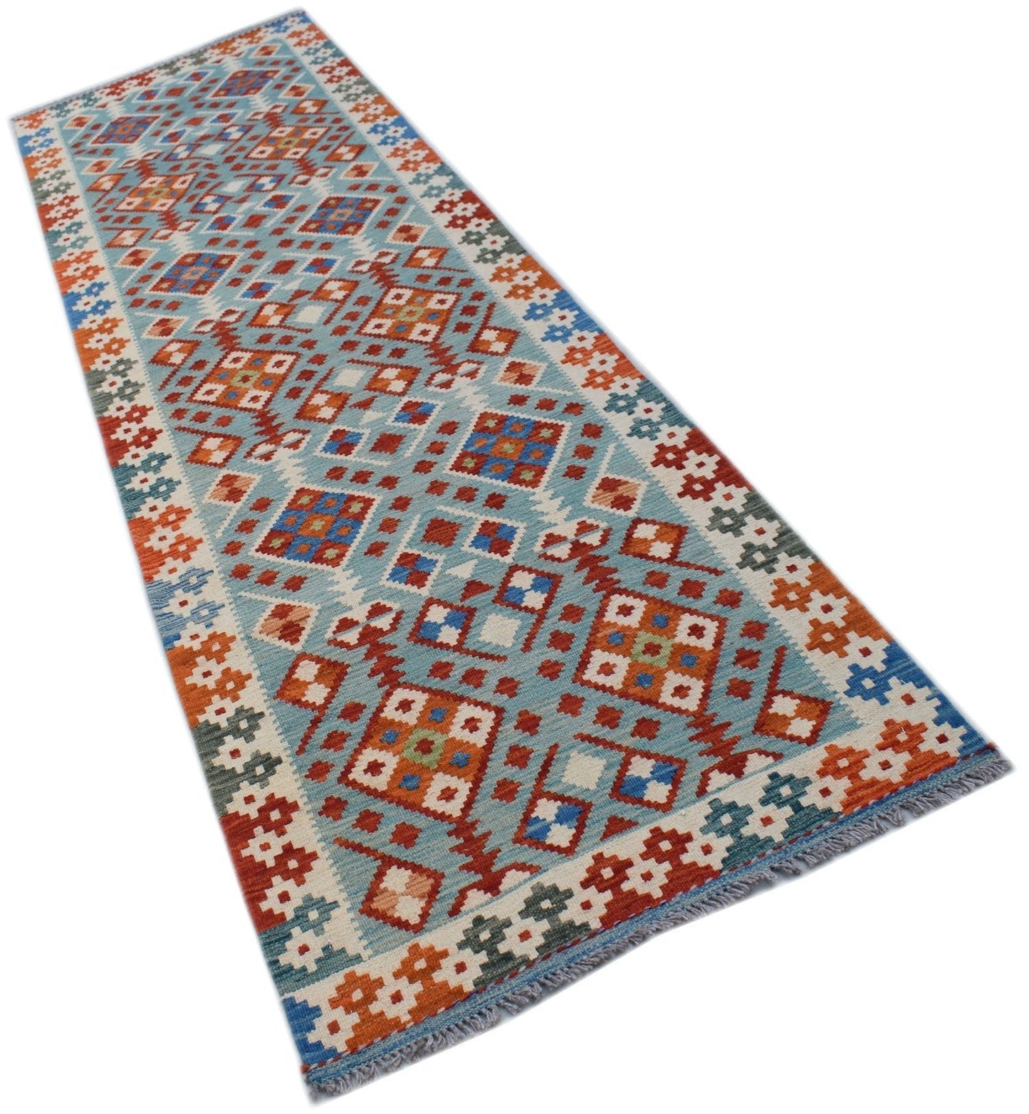 A handmade Afghan Maimana wool runner rug featuring a geometric pattern in blue, orange, and red.
