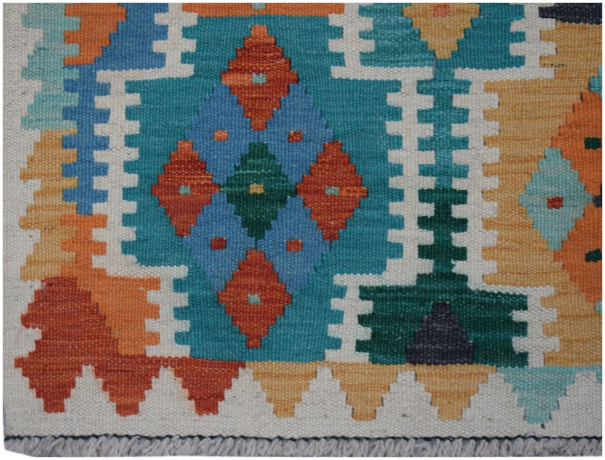 Handwoven Afghan Maimana kilim runner featuring a geometric pattern in vibrant wool colors.