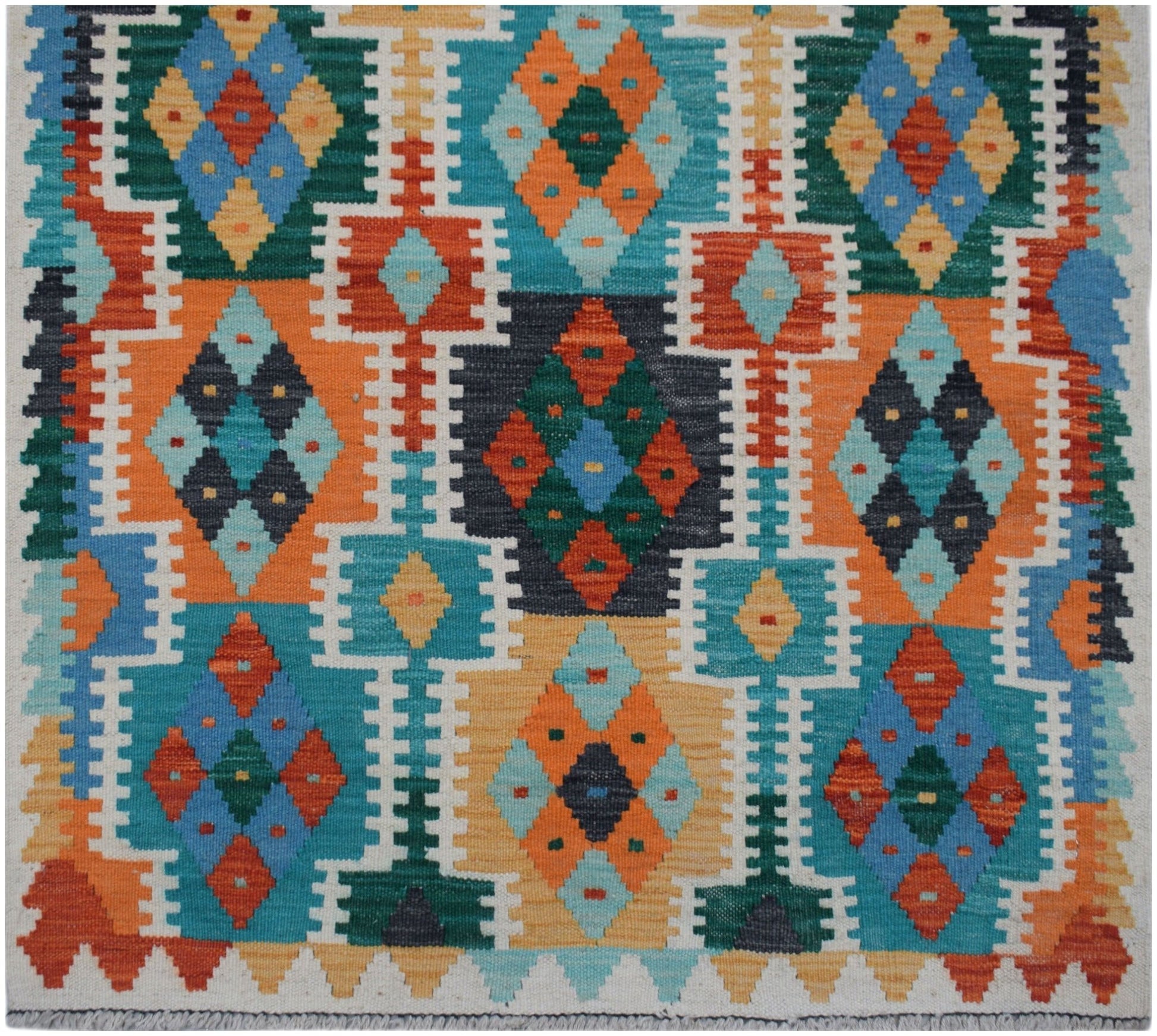 Handwoven Afghan Maimana wool runner featuring a vibrant geometric diamond pattern.