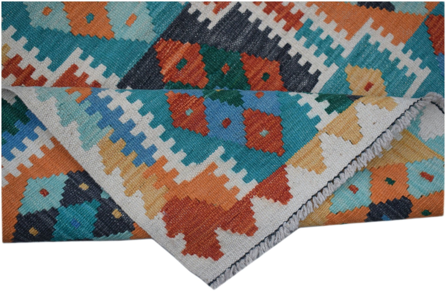 A handmade Afghan Maimana wool kilim runner featuring a colorful geometric pattern.