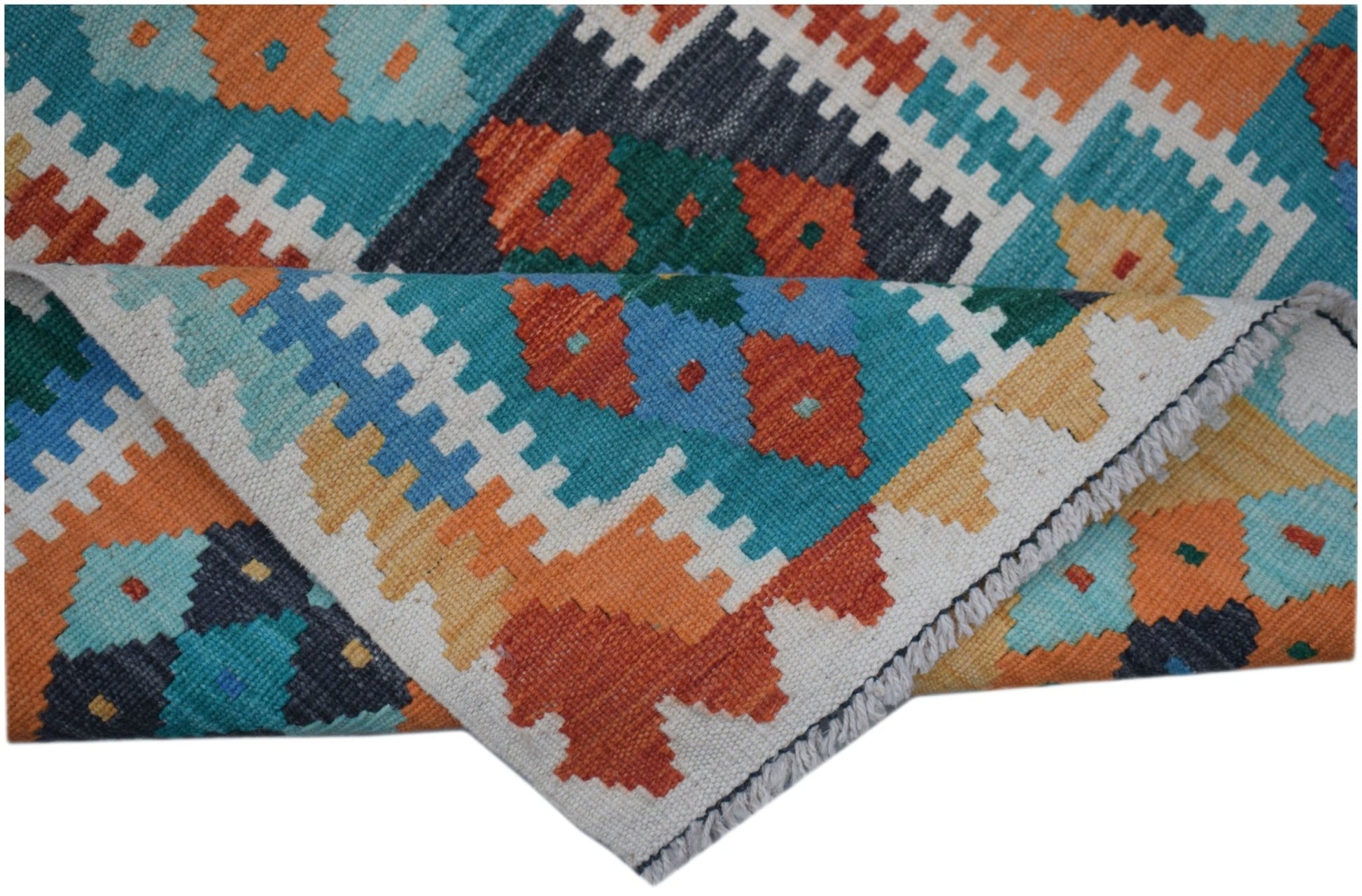 A handmade Afghan Maimana wool kilim runner featuring a colorful geometric pattern.