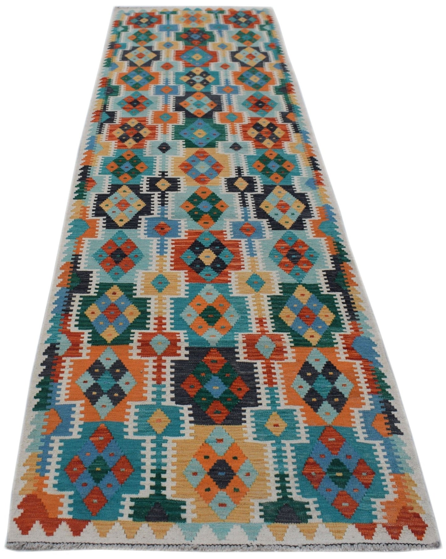 A handmade Afghan Maimana wool runner rug featuring a colorful geometric pattern.