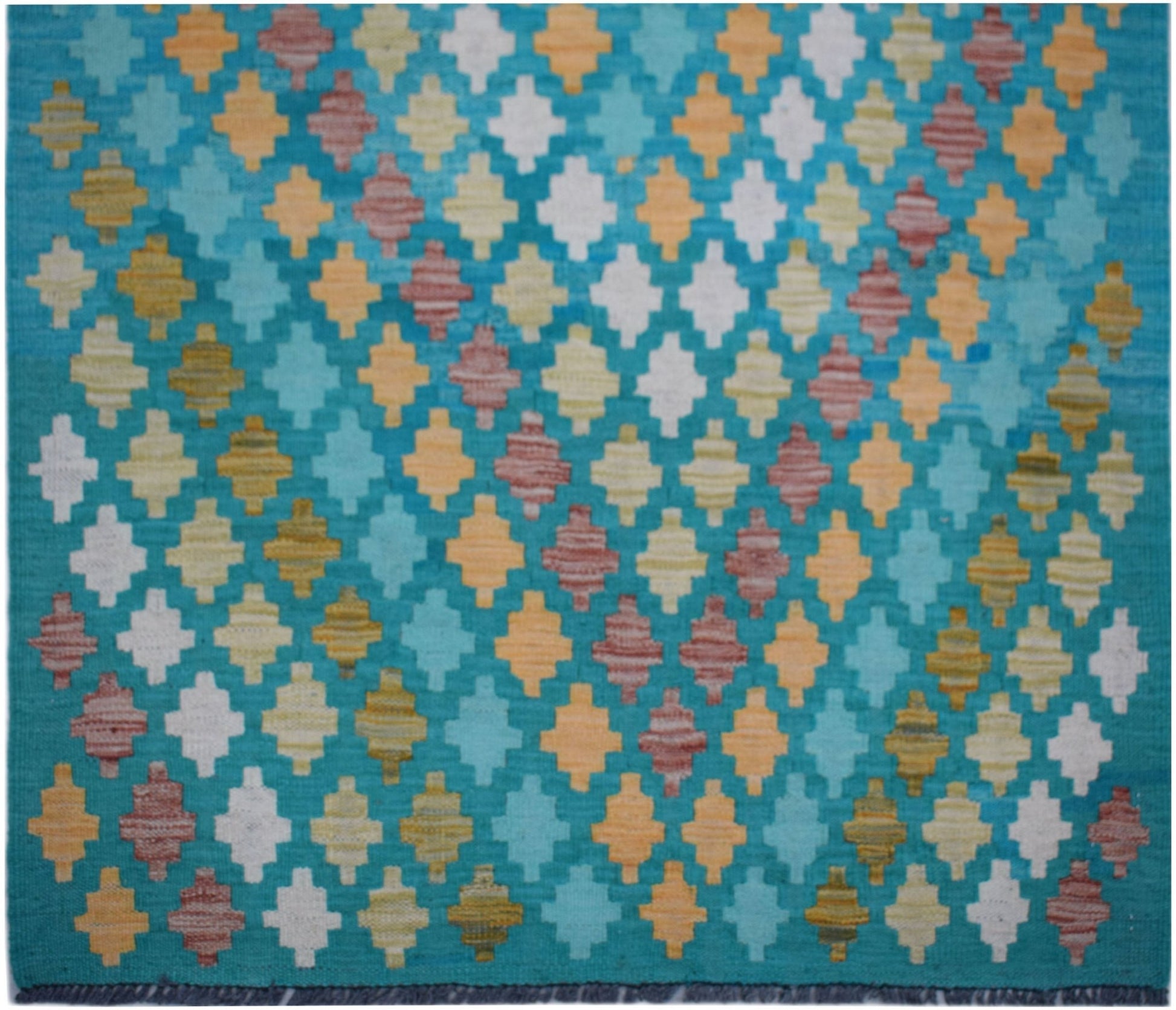 Handwoven Afghan Maimana kilim runner featuring a repeating geometric pattern in vibrant colors.