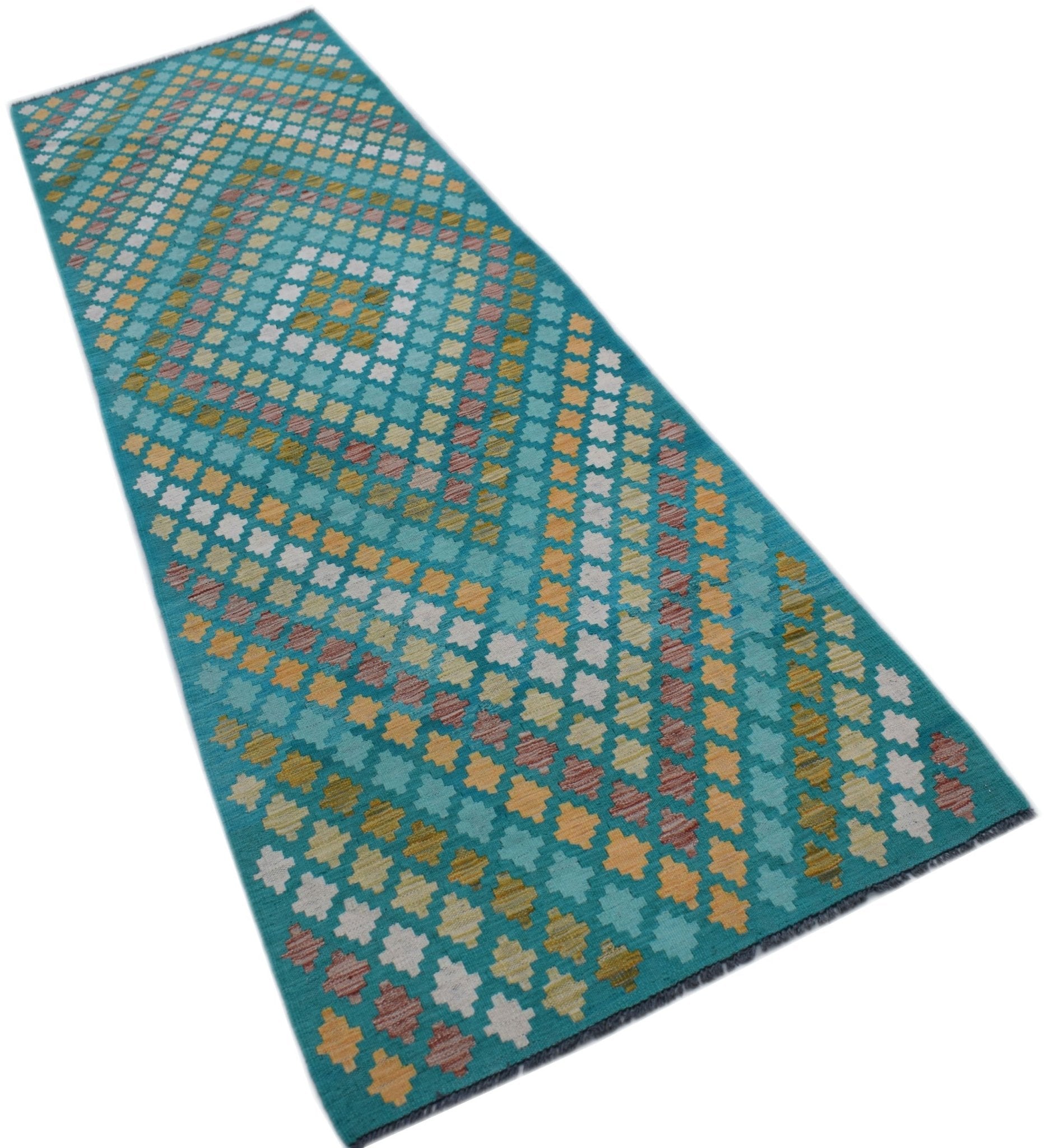 A handmade Afghan Maimana wool runner rug featuring a geometric diamond pattern in teal and gold.