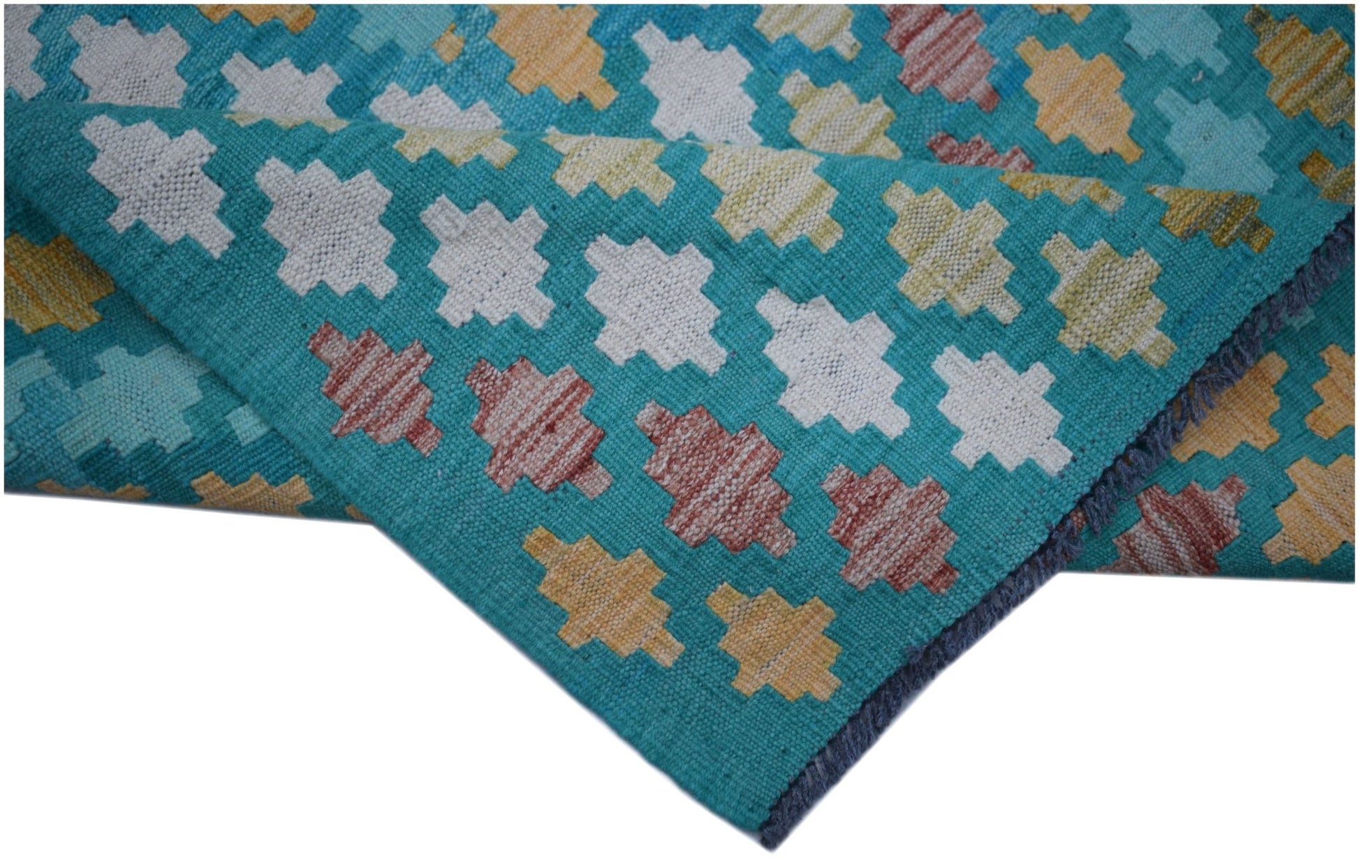 Handwoven Afghan Maimana kilim runner featuring a geometric pattern in teal, white, and gold.