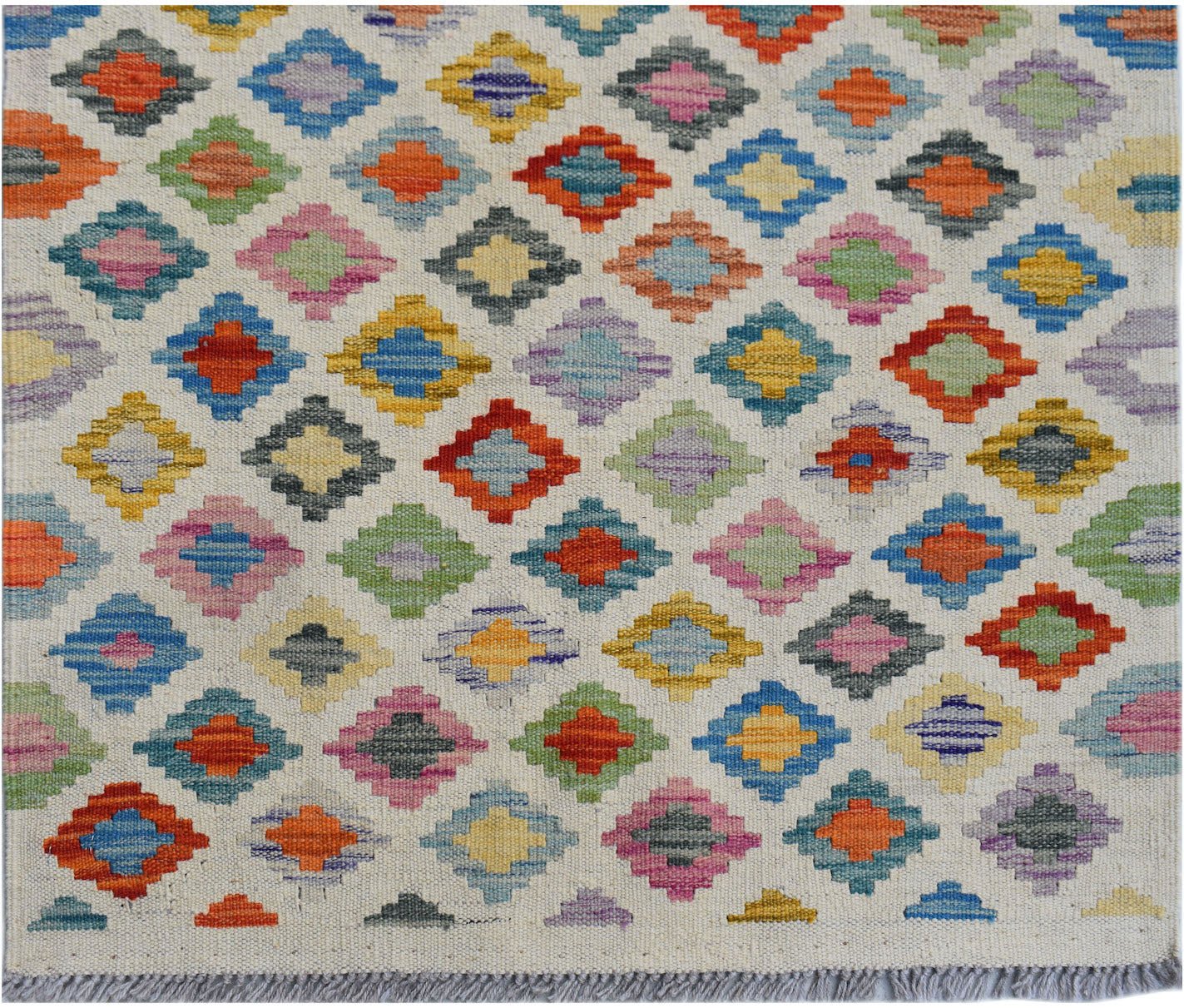 Handwoven Afghan Maimana wool runner featuring a colorful geometric diamond pattern.