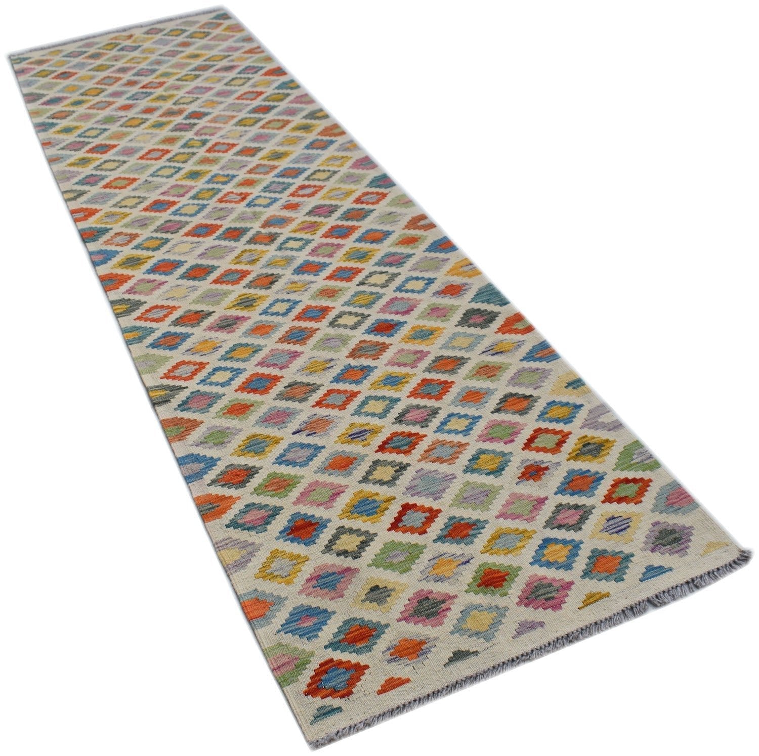 A handmade Afghan Maimana wool runner rug featuring a colorful geometric diamond pattern.