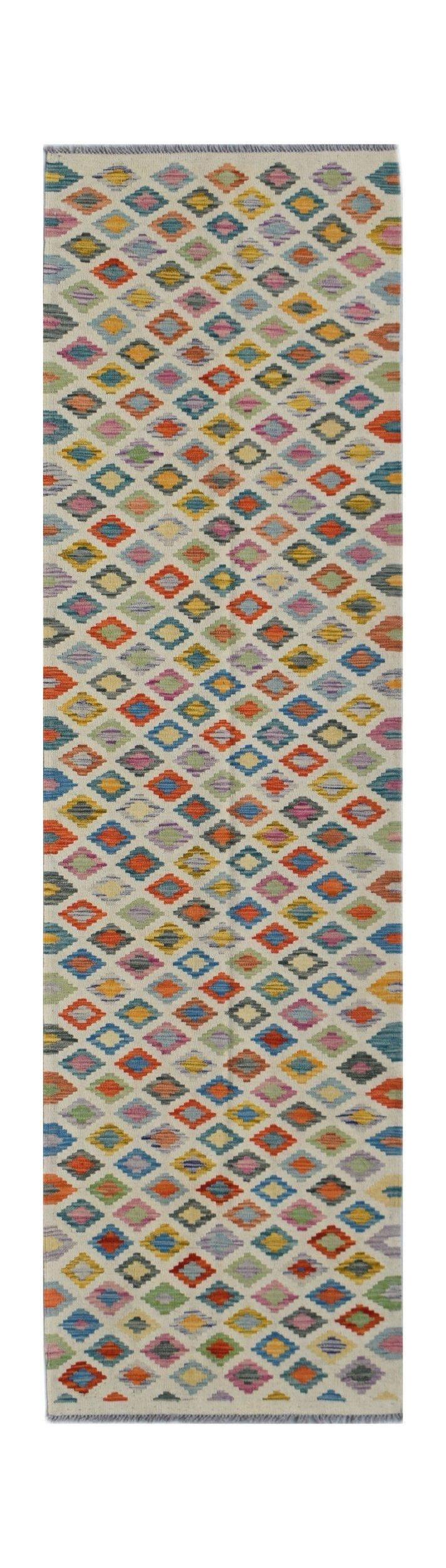 Handwoven Afghan Maimana wool runner rug featuring a colorful geometric diamond pattern.