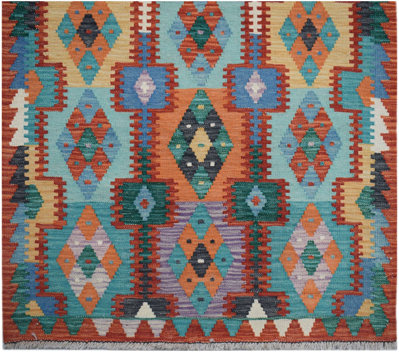 Handwoven Afghan Maimana wool runner featuring a vibrant geometric pattern in multi-colored tones.