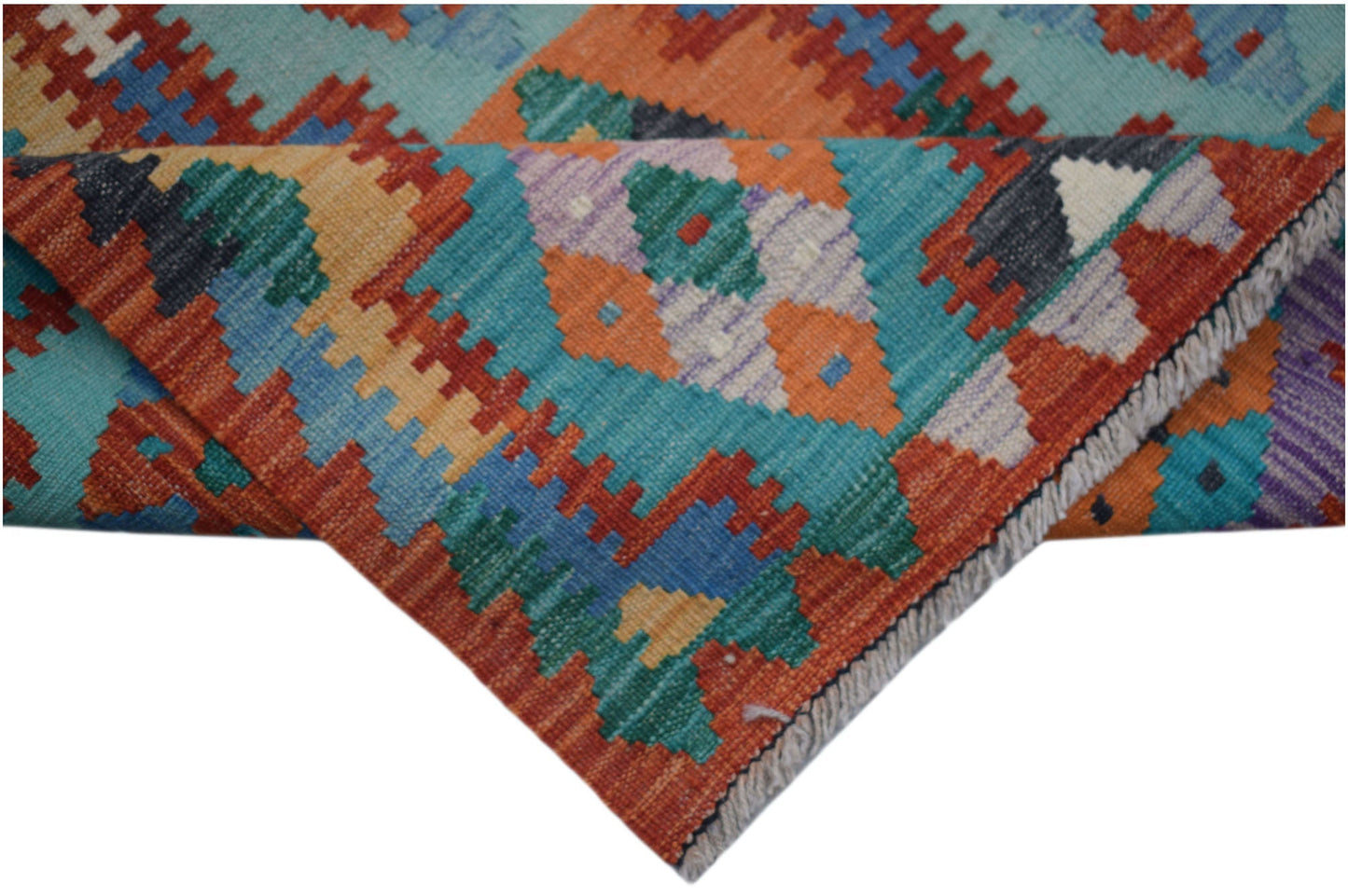 Handwoven Afghan Maimana wool kilim runner featuring a vibrant geometric pattern.