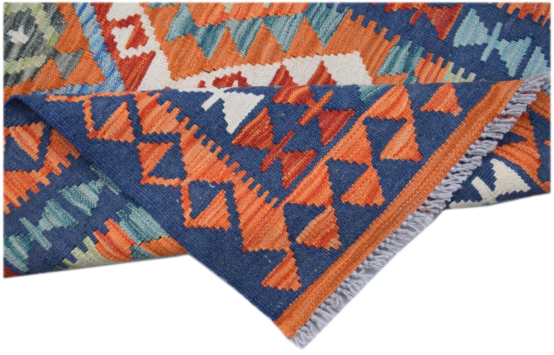 A handmade Afghan Maimana wool kilim runner featuring geometric patterns in blue and orange.