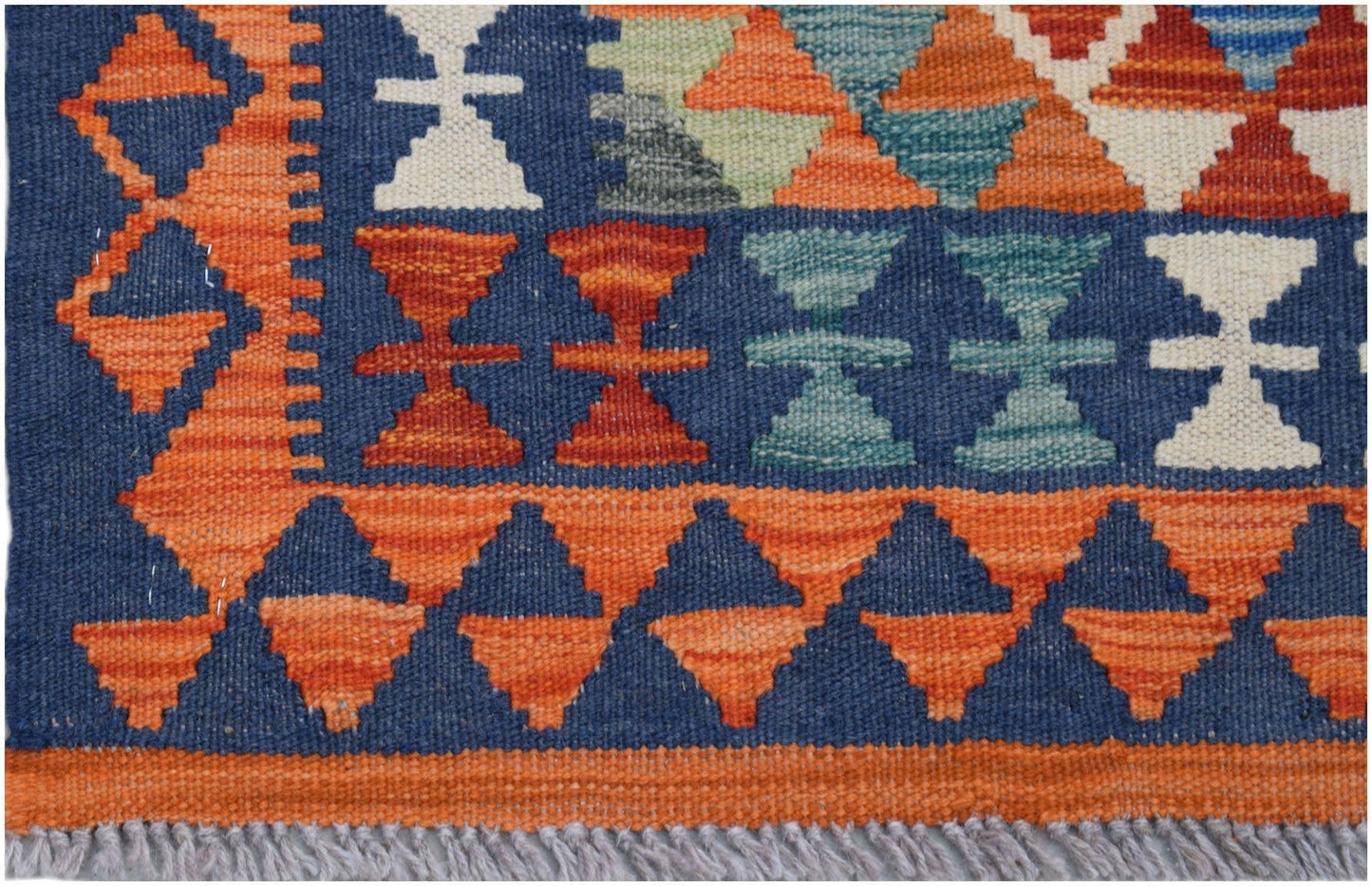 Handwoven Afghan Maimana kilim runner featuring geometric patterns in blue, orange, and white.