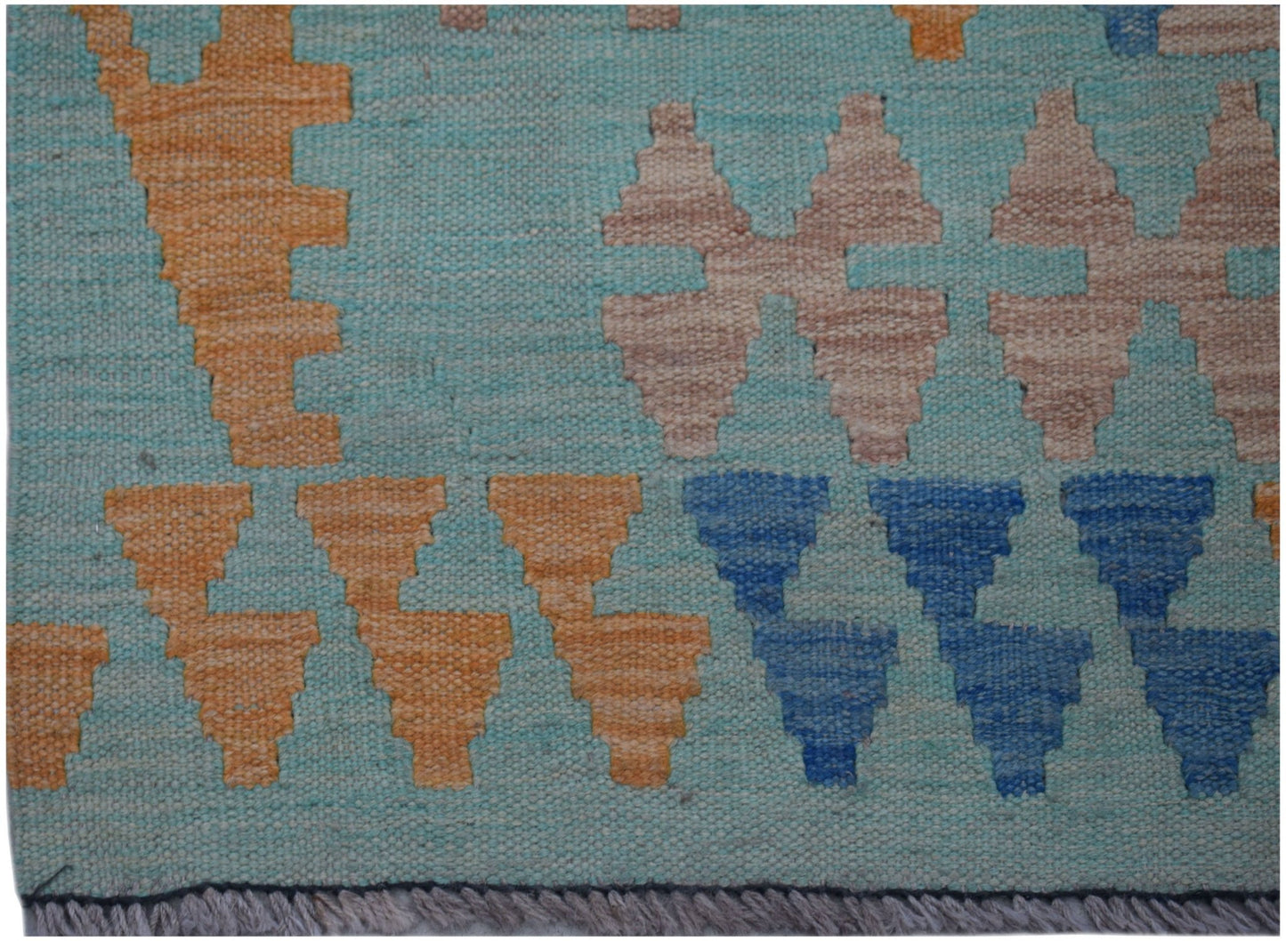 Handwoven Afghan Maimana kilim runner featuring geometric patterns in blue, orange, and beige.