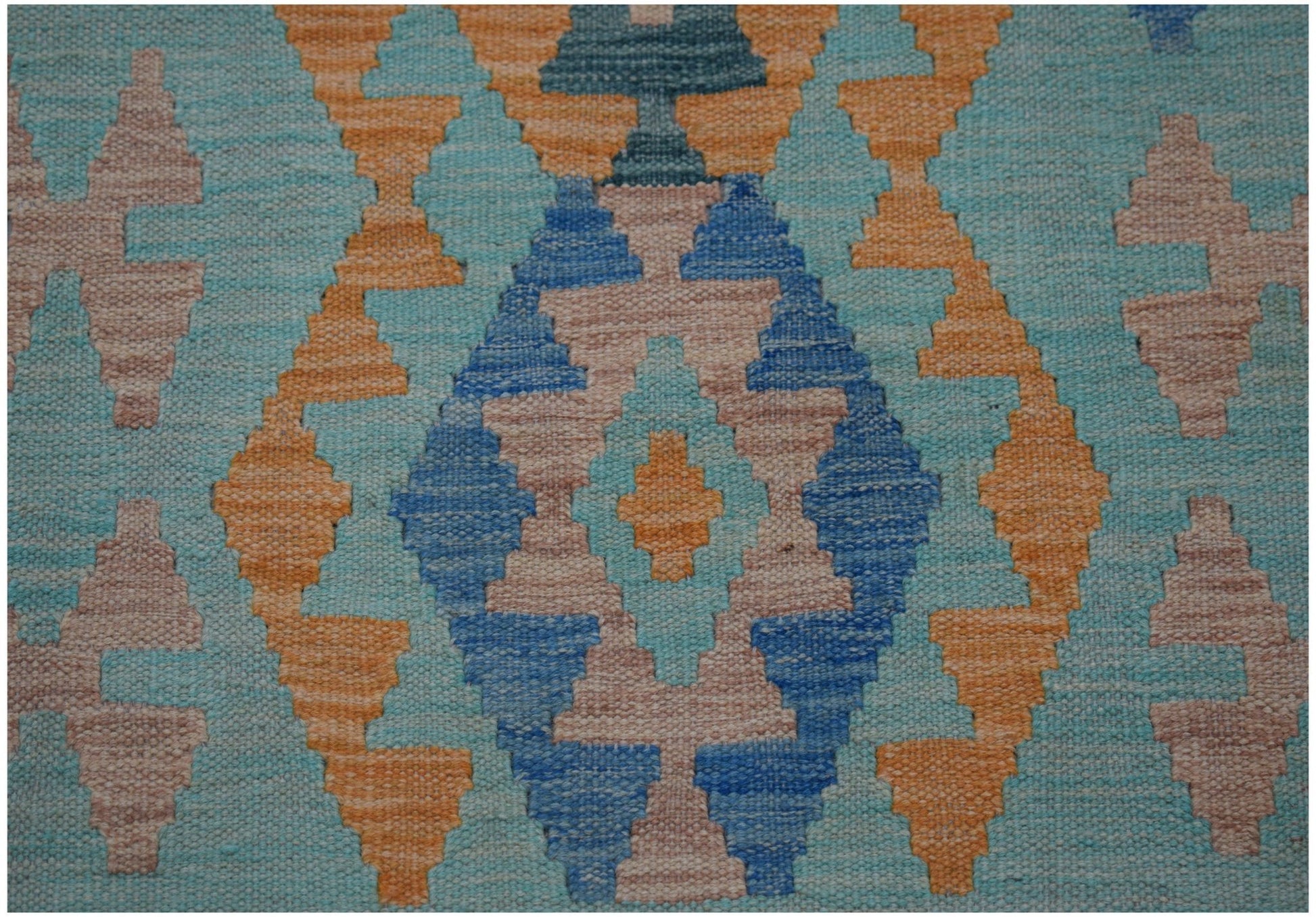 Handwoven Afghan Maimana kilim runner featuring a geometric diamond pattern in blue and orange.