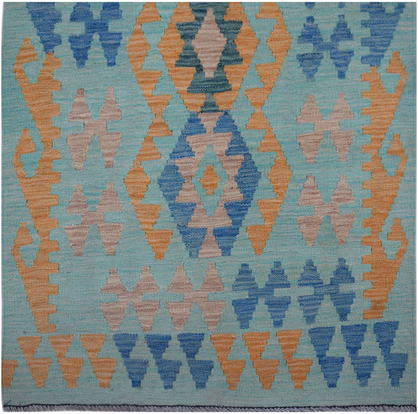 Handwoven Afghan Maimana wool runner featuring a geometric pattern in blue, orange, and beige.