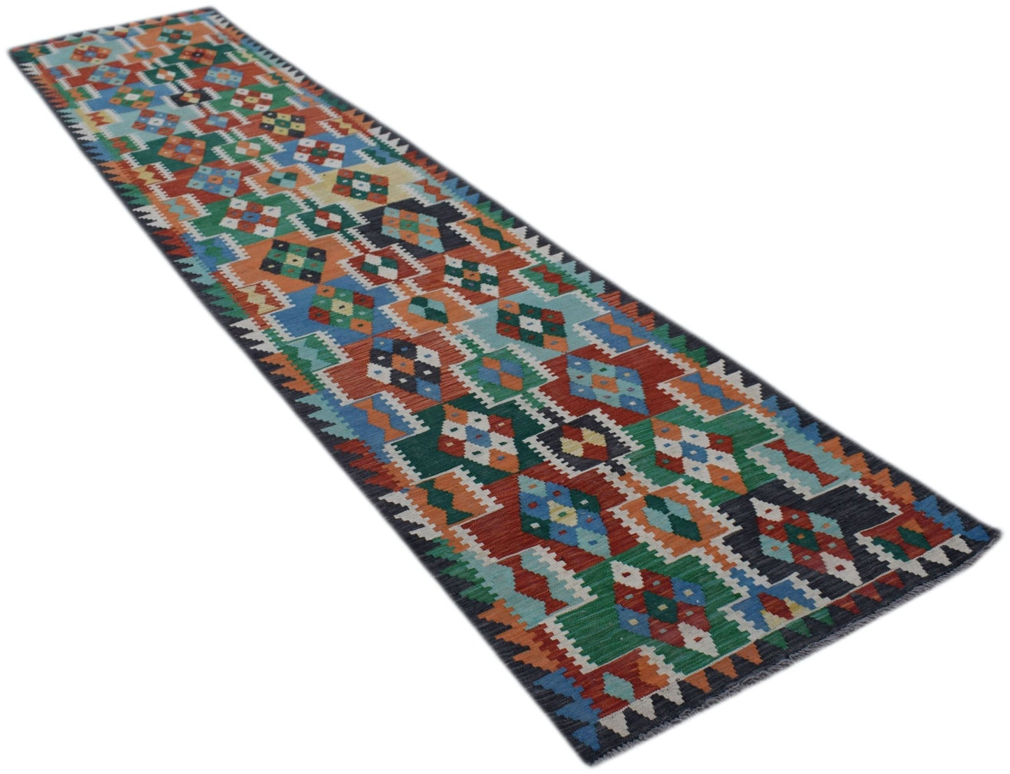 A handmade Afghan Maimana wool runner rug featuring a colorful geometric diamond pattern.