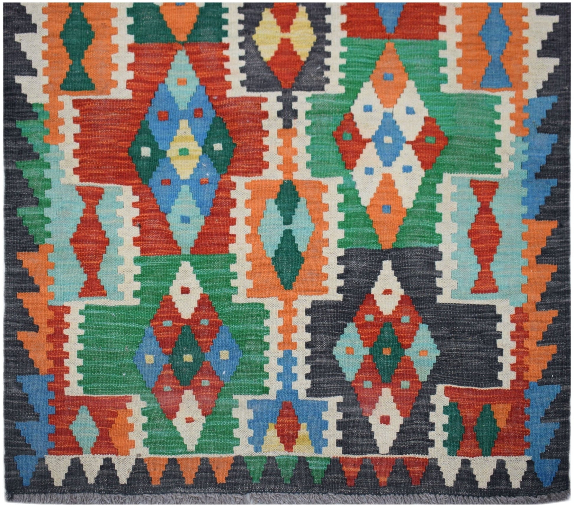 Handwoven Afghan Maimana wool kilim runner featuring a colorful geometric diamond pattern.