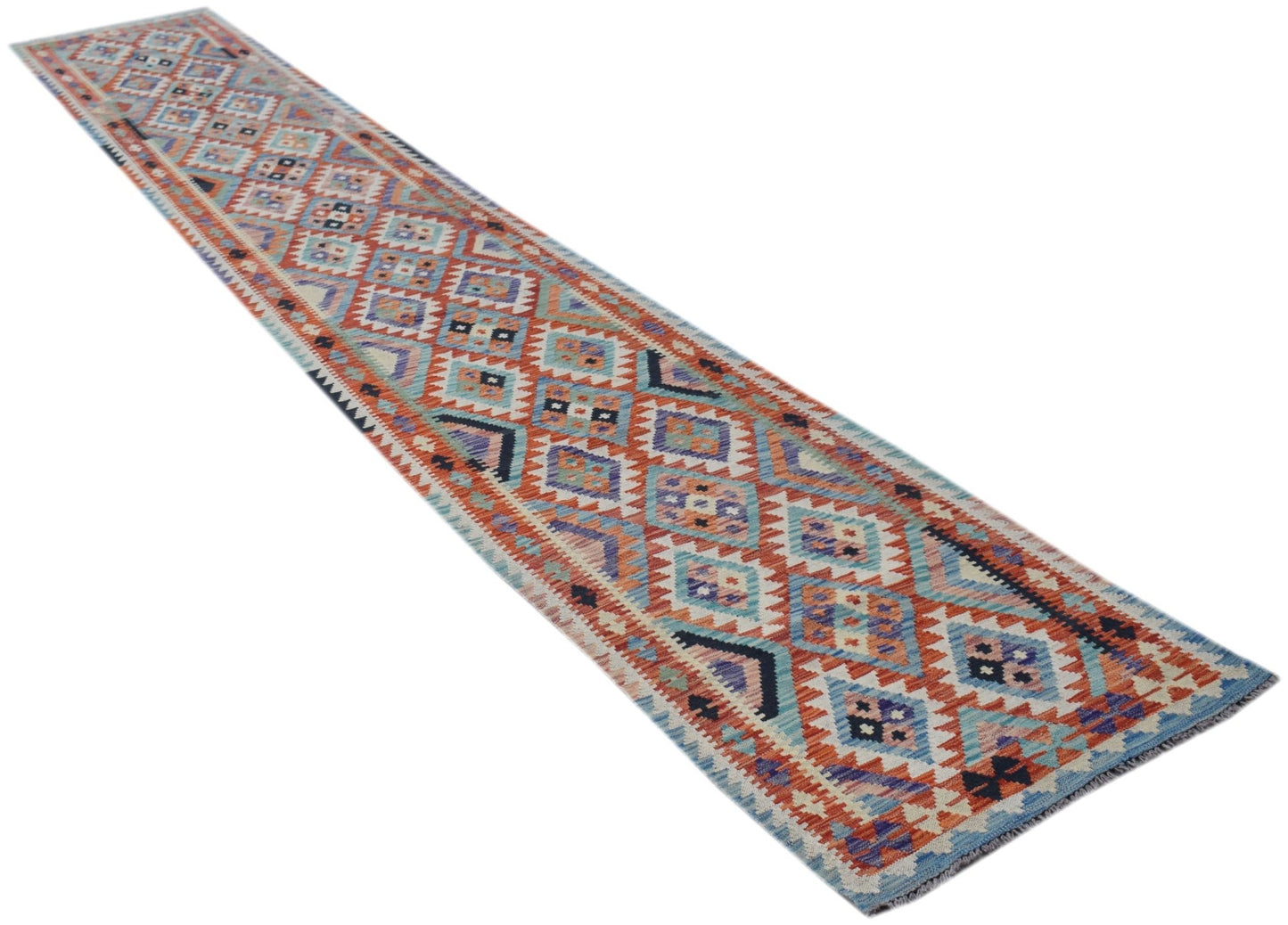 A long, handwoven Afghan Maimana kilim runner featuring a geometric diamond pattern in warm tones.