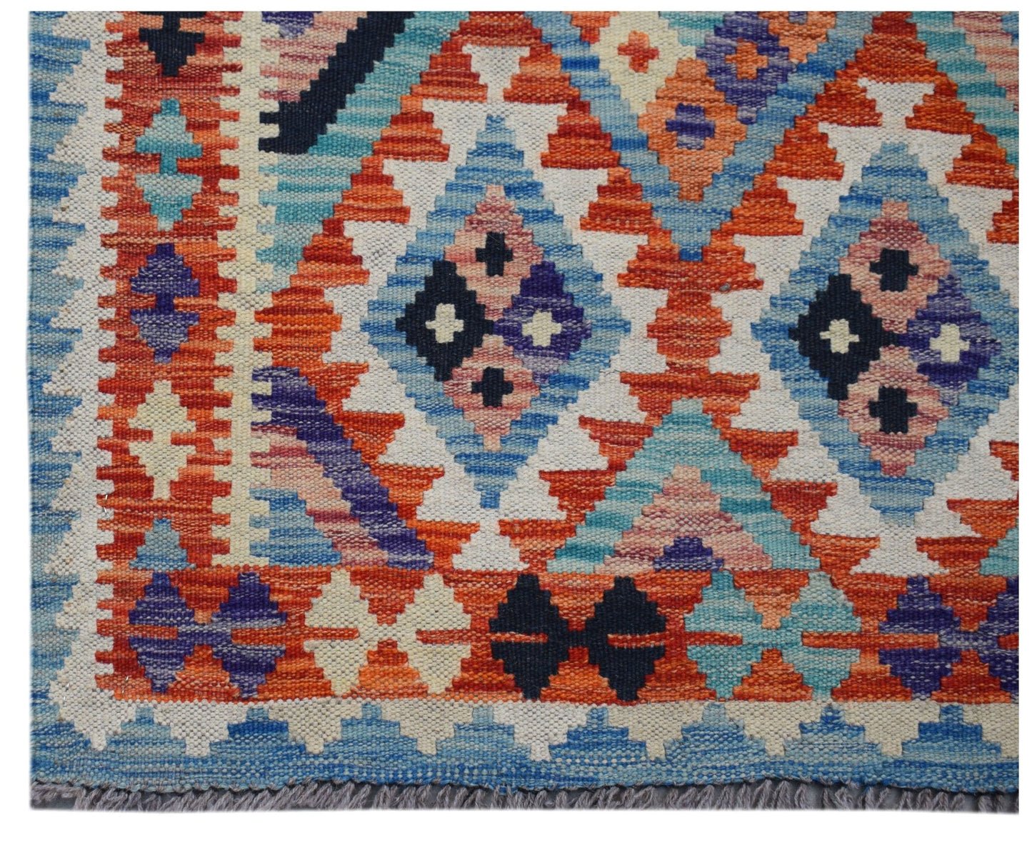Handwoven Afghan Maimana wool runner featuring a vibrant geometric pattern in blue and orange.