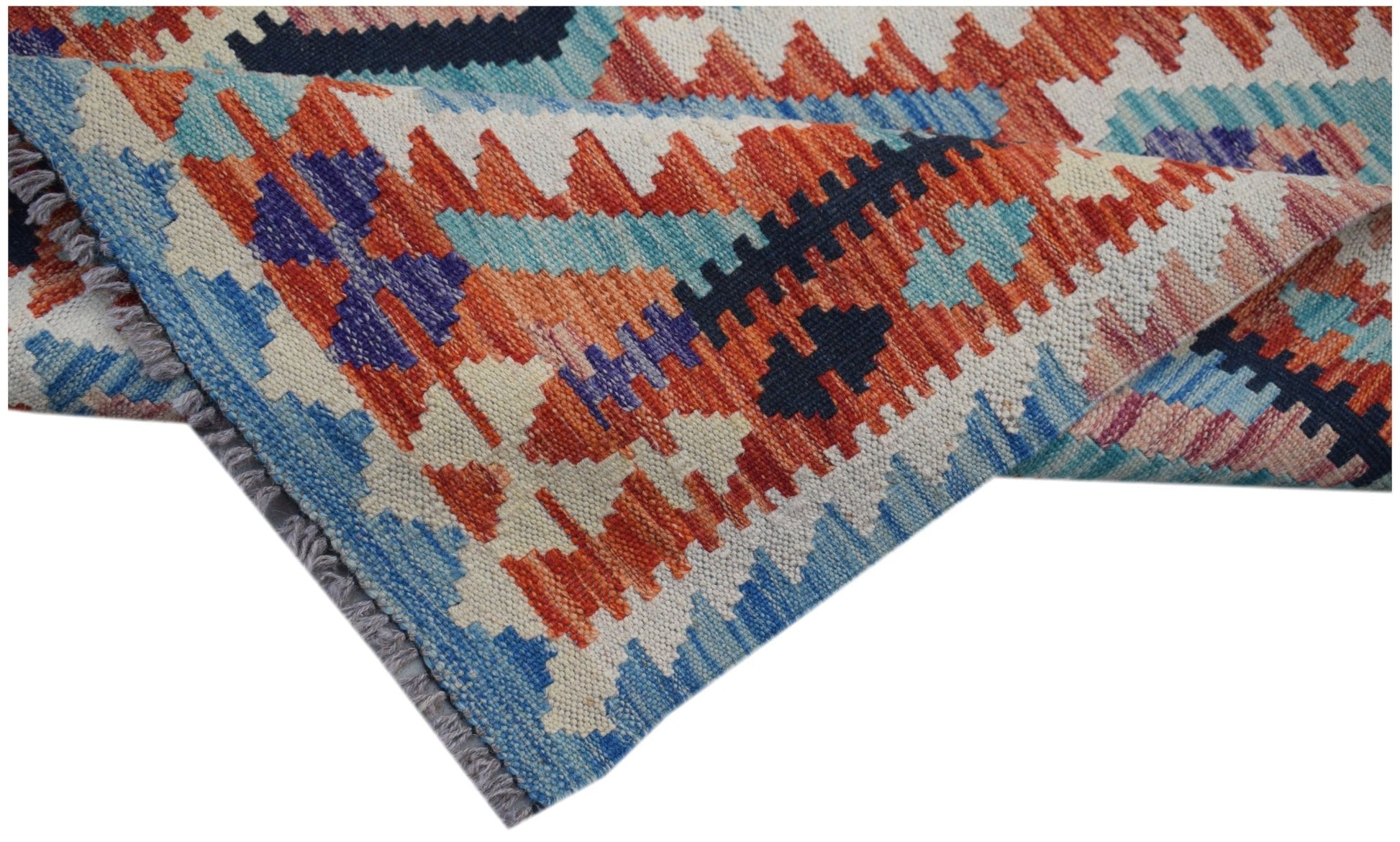 A handwoven Afghan Maimana kilim runner featuring a geometric pattern in vibrant wool colors.