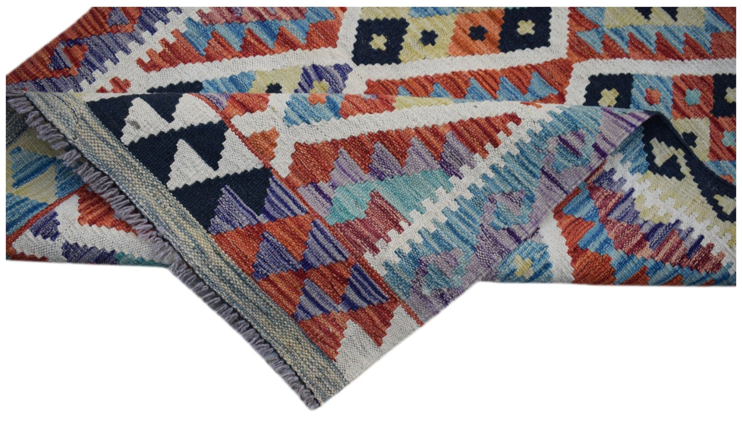 Handwoven Afghan Maimana wool kilim runner featuring a colorful geometric pattern.