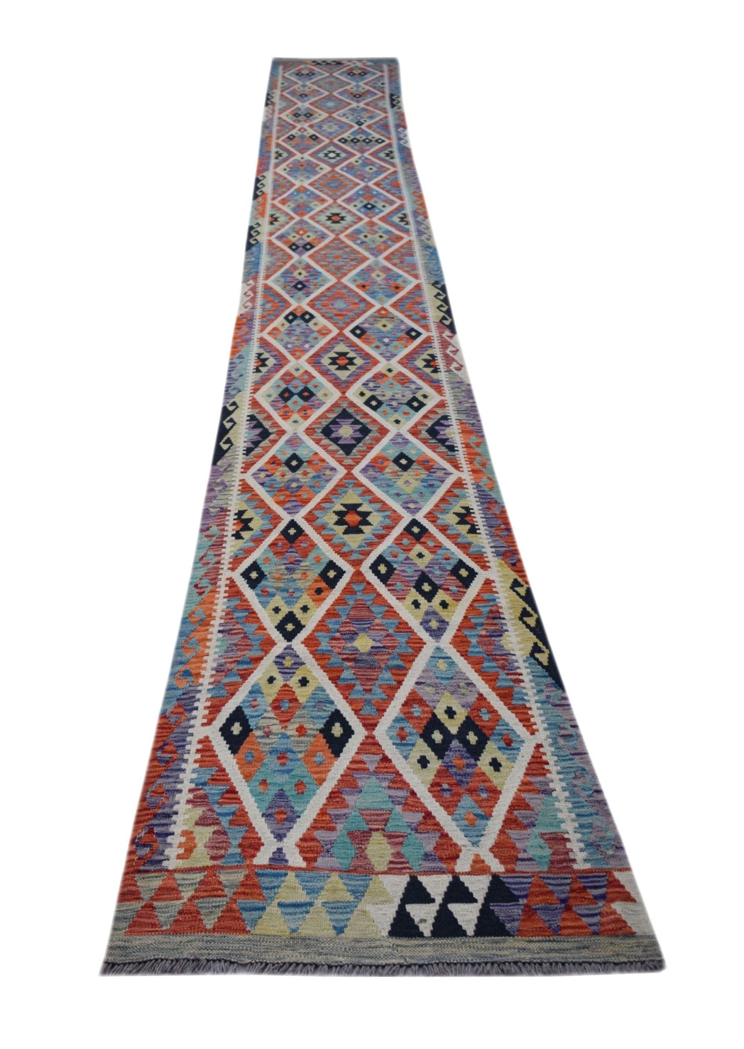A long, handmade Afghan Maimana kilim runner featuring a colorful geometric diamond pattern.