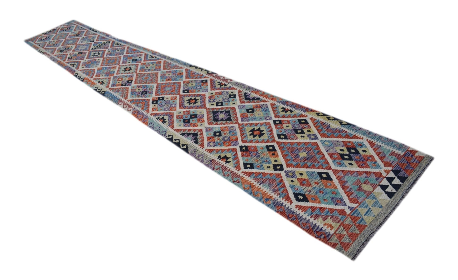A long, handmade Afghan Maimana wool runner rug featuring a colorful geometric diamond pattern.