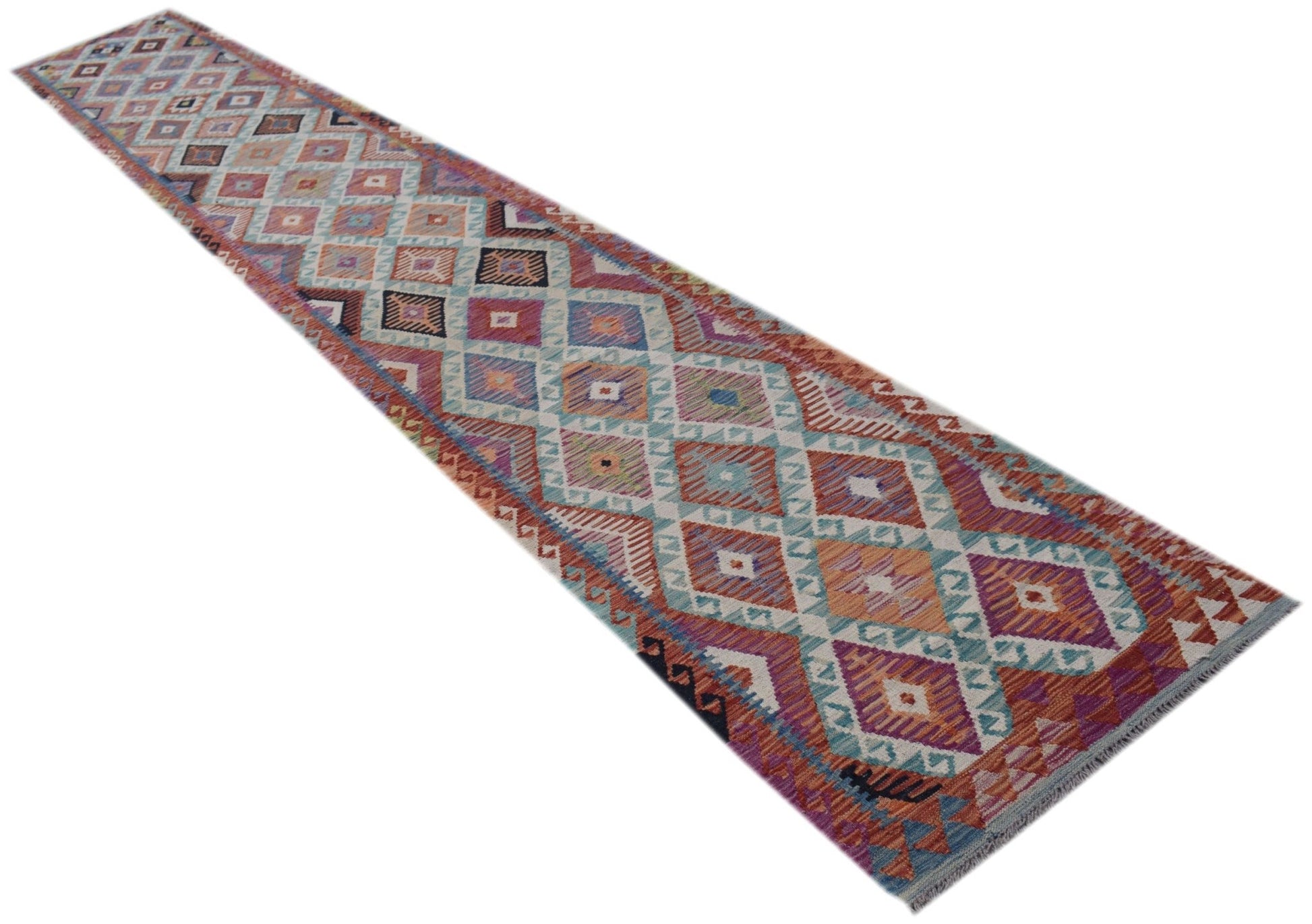 A long, handmade Afghan Maimana Kilim runner featuring a colorful geometric diamond pattern.