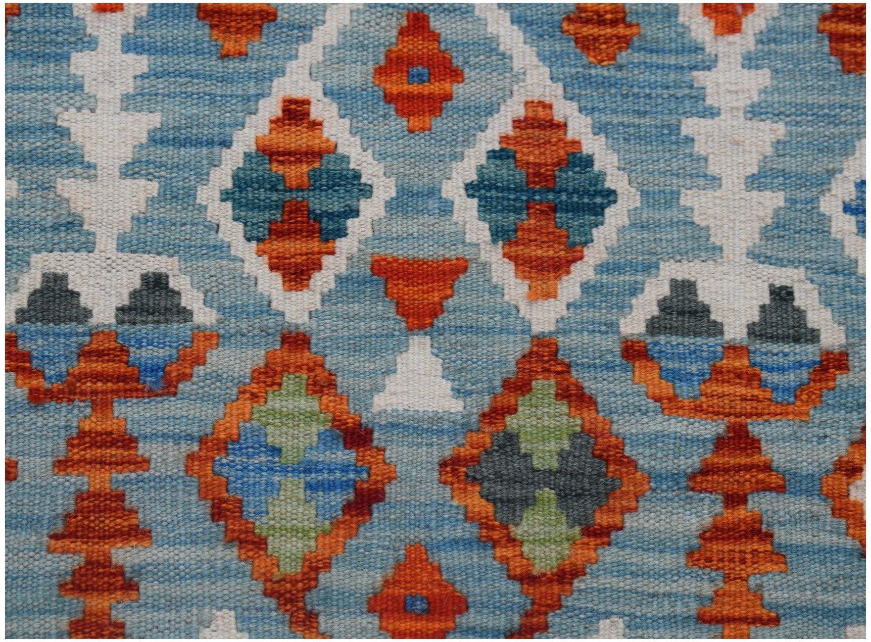 Handwoven Afghan Maimana wool kilim runner featuring a geometric pattern in blue and orange.