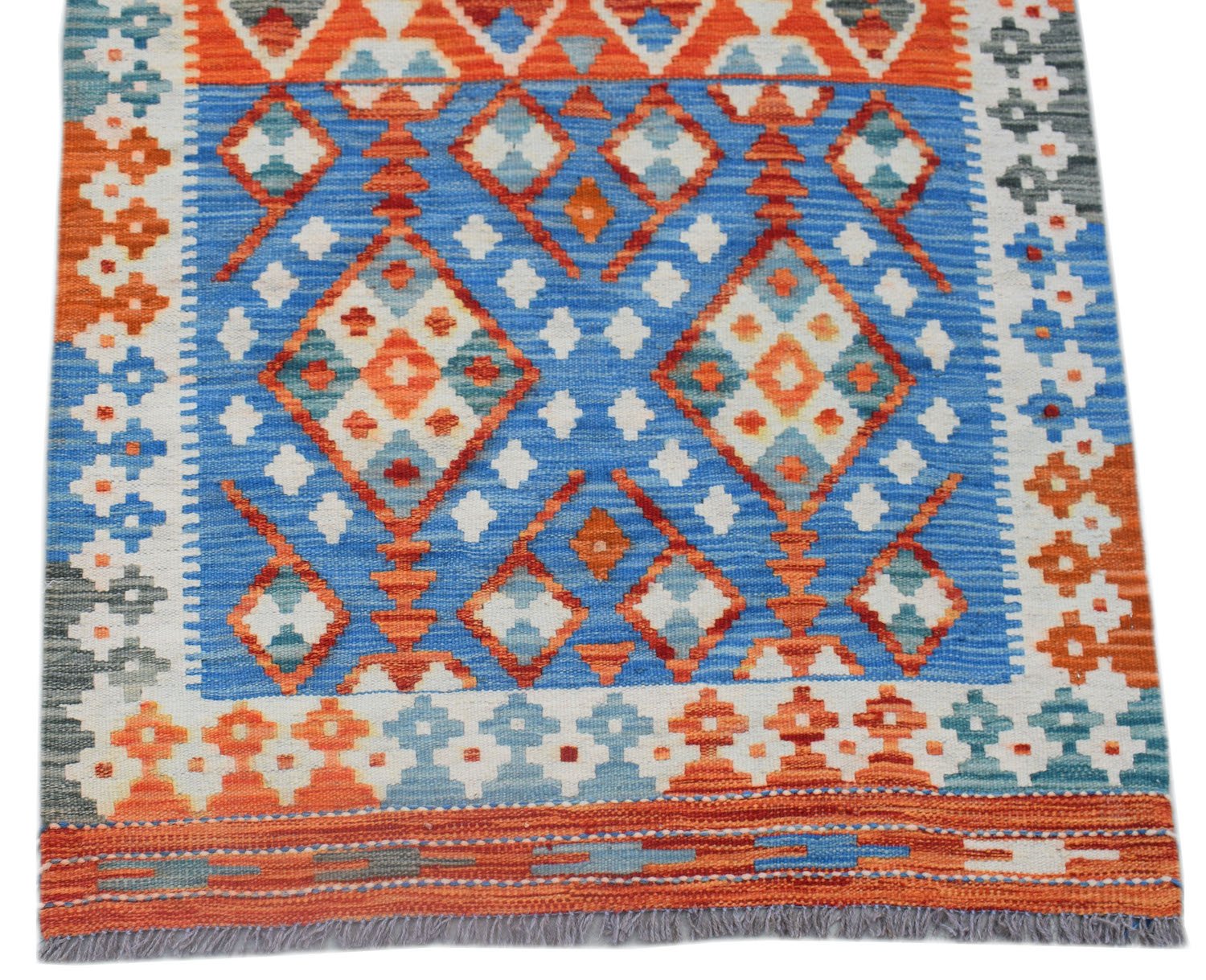 Handwoven Afghan Maimana wool runner featuring a vibrant geometric pattern in blue and orange.