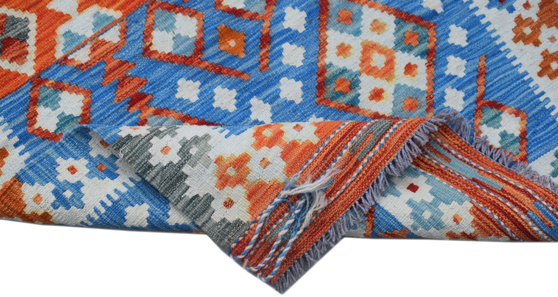 A handmade Afghan Maimana Kilim runner featuring a geometric pattern in blue, orange, and white.