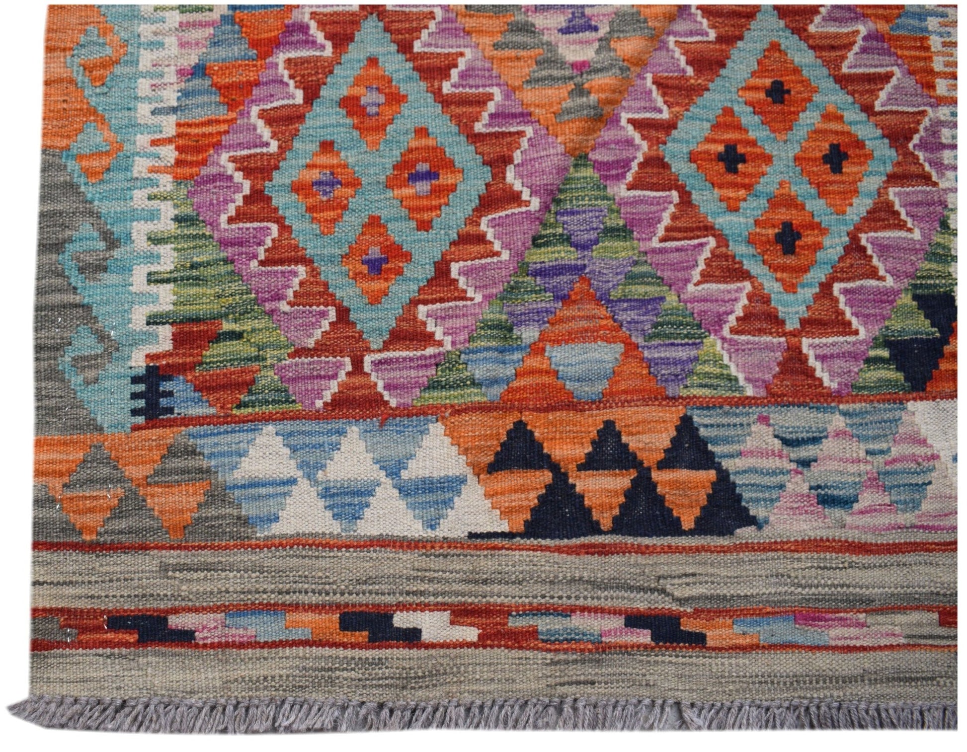 Handwoven Afghan Maimana kilim runner featuring vibrant geometric diamond patterns in wool.