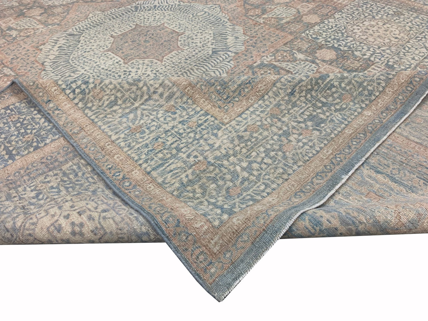 A handmade Afghan Chobi rug featuring a traditional Mamluk pattern in muted blue and beige tones.