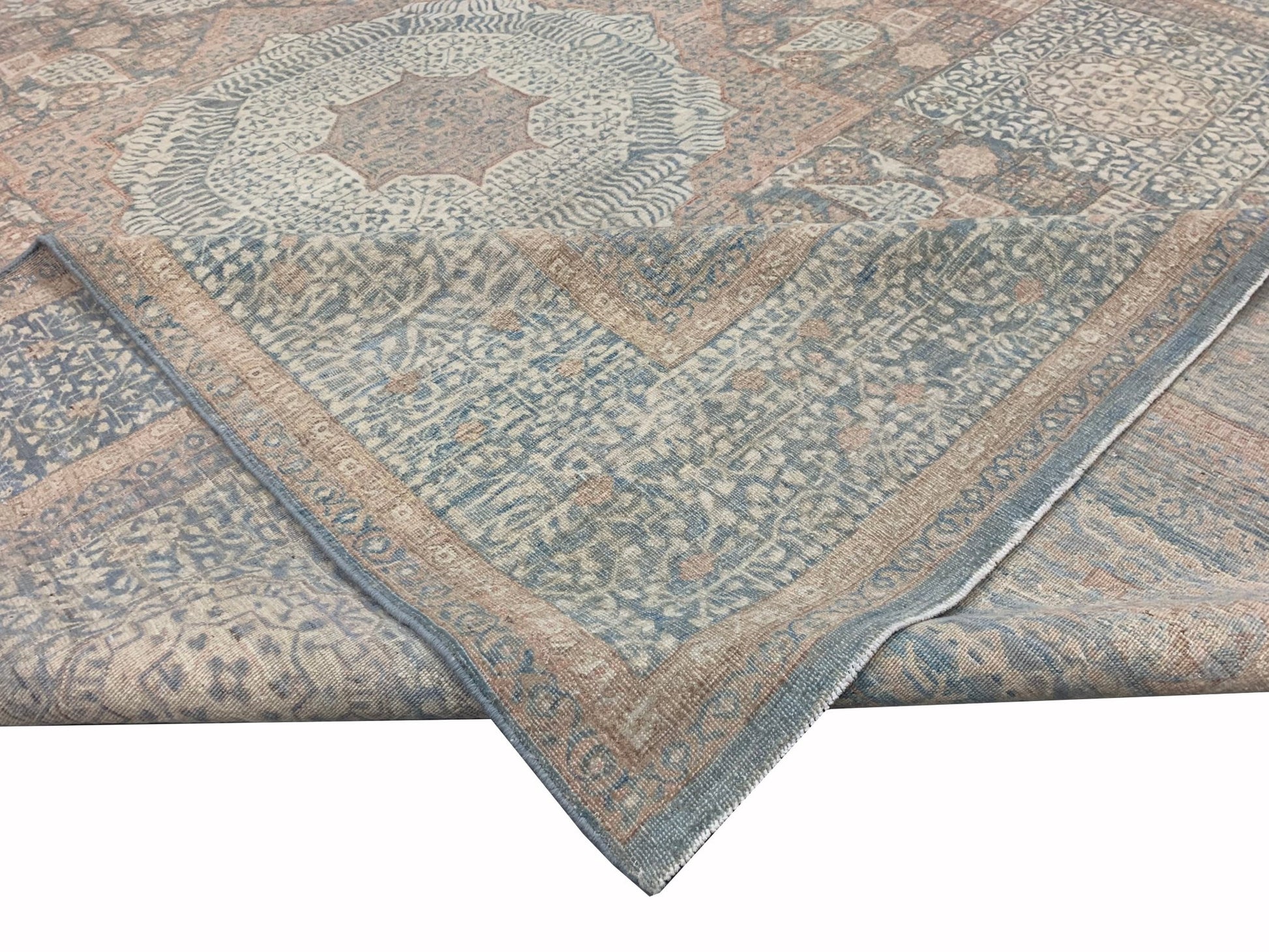 A handmade Afghan Chobi rug featuring a traditional Mamluk pattern in muted blue and beige tones.