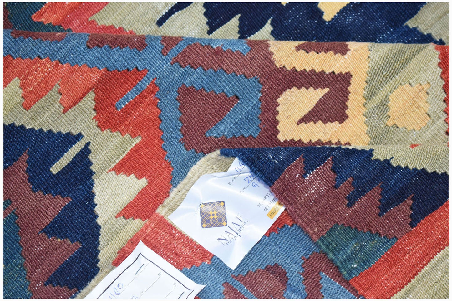 Afghan Mazari Sharif Kilim with geometric patterns in red, blue, and tan.