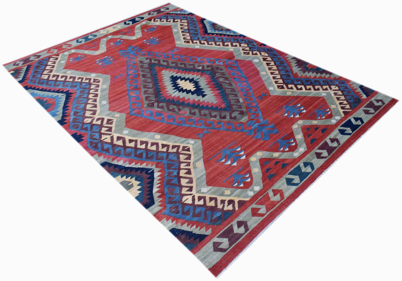 Handwoven Afghan Mazari Sharif kilim rug featuring a geometric pattern in red, blue, and grey.
