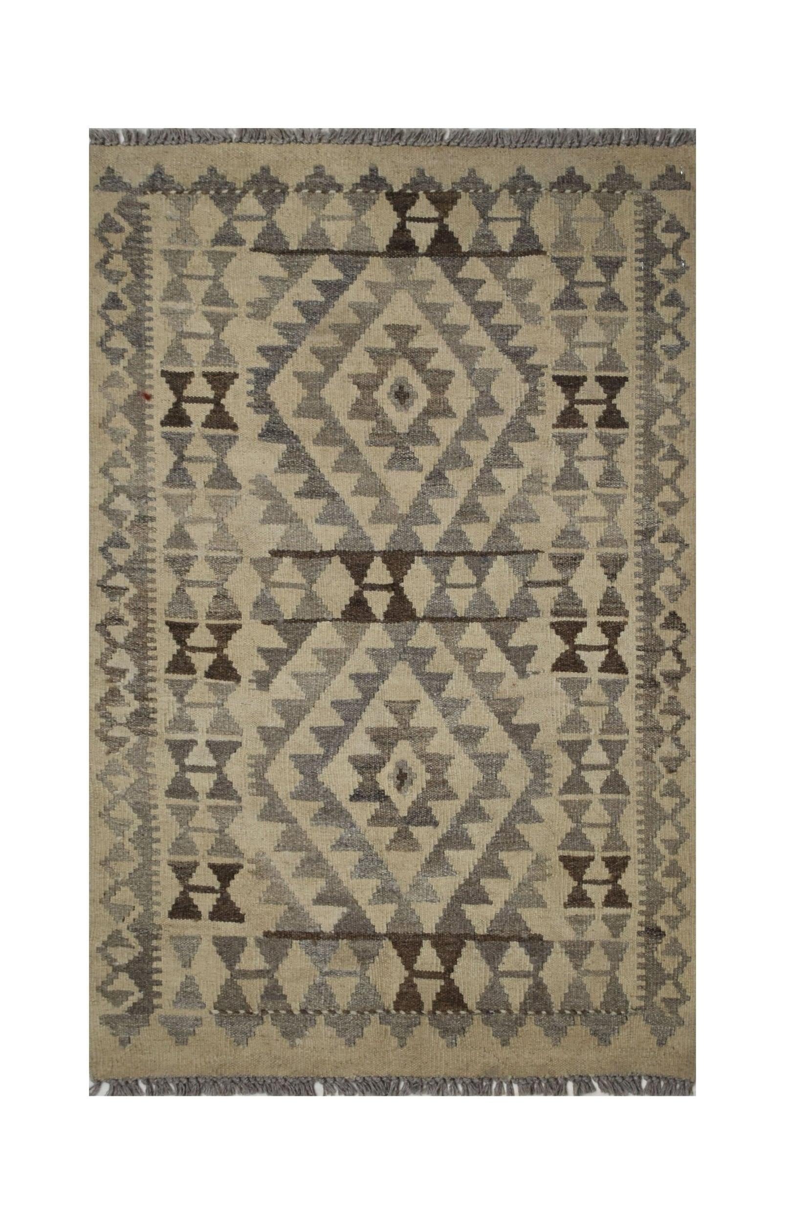 Handmade Afghan Maiamana kilim rug featuring a geometric pattern in neutral grey and brown tones.