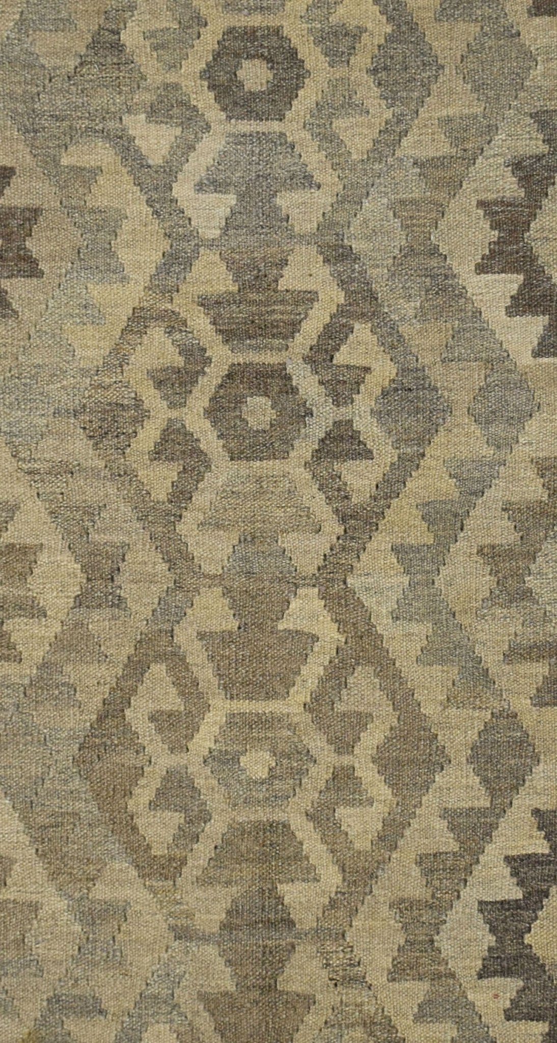 Handmade Afghan Maiamana kilim rug featuring a repeating geometric pattern in natural wool tones.