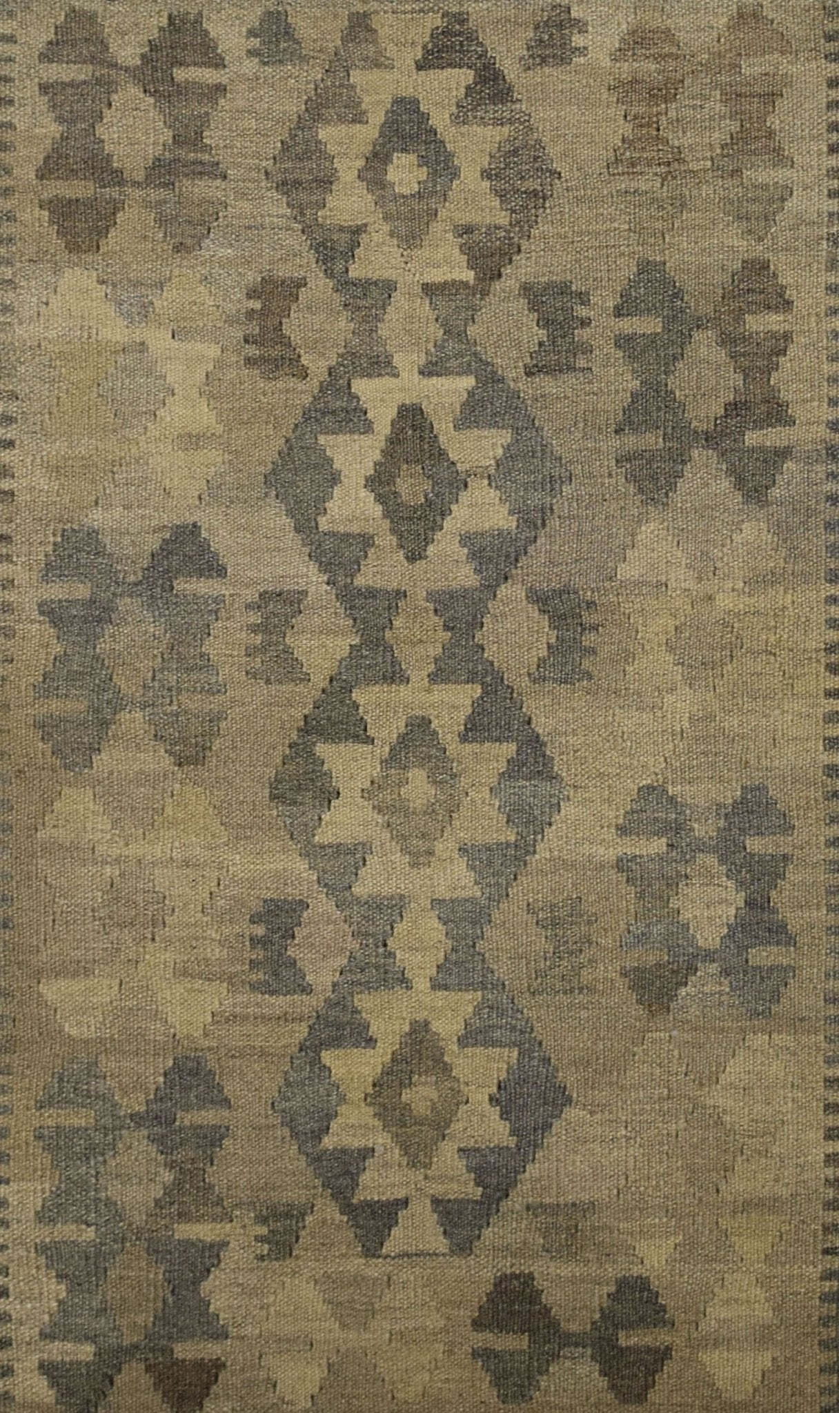 Handmade Afghan Maimana kilim rug featuring a geometric pattern in natural undyed wool tones.